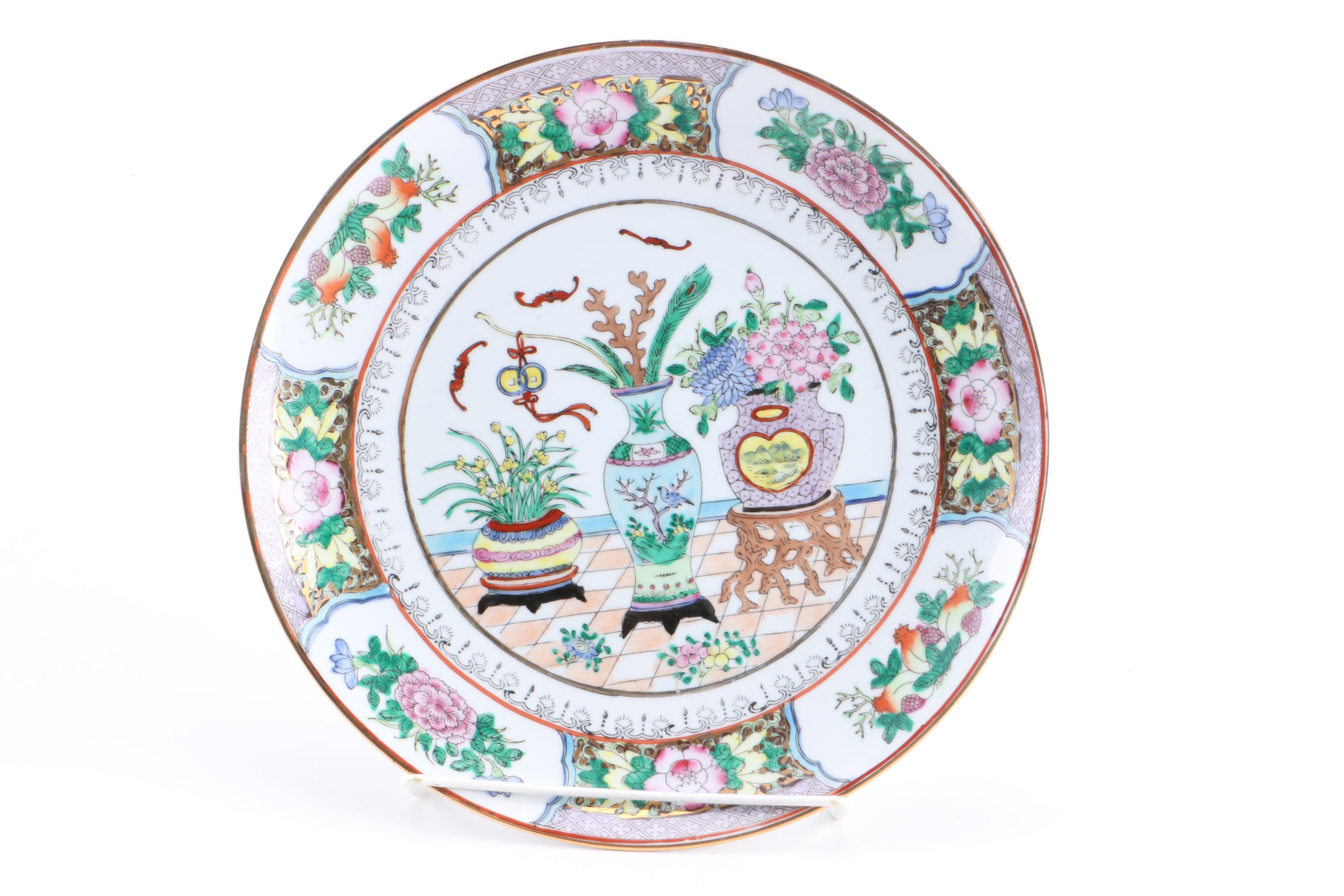 Assortment of Asian Themed Plates and Stands