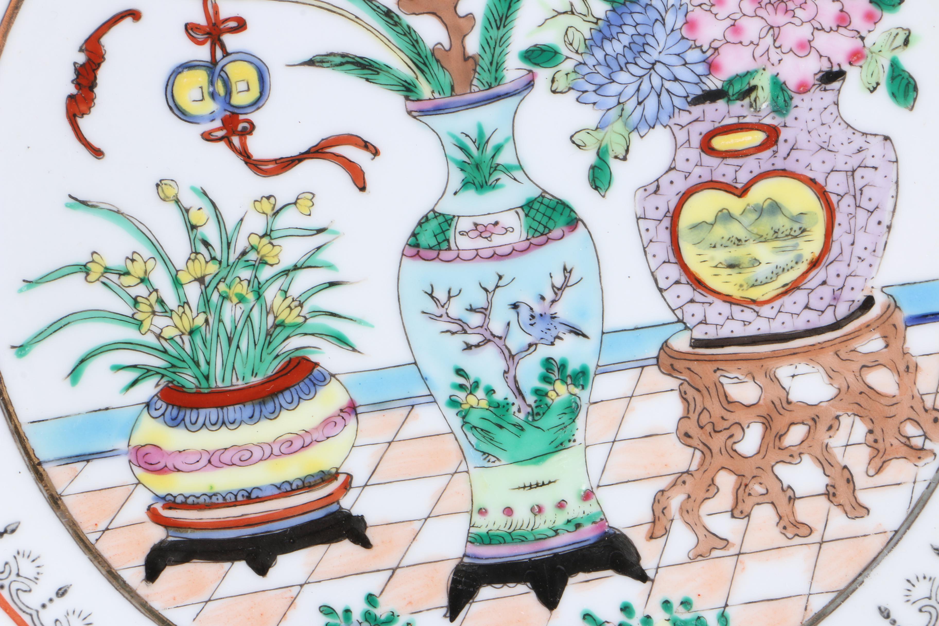 Assortment of Asian Themed Plates and Stands