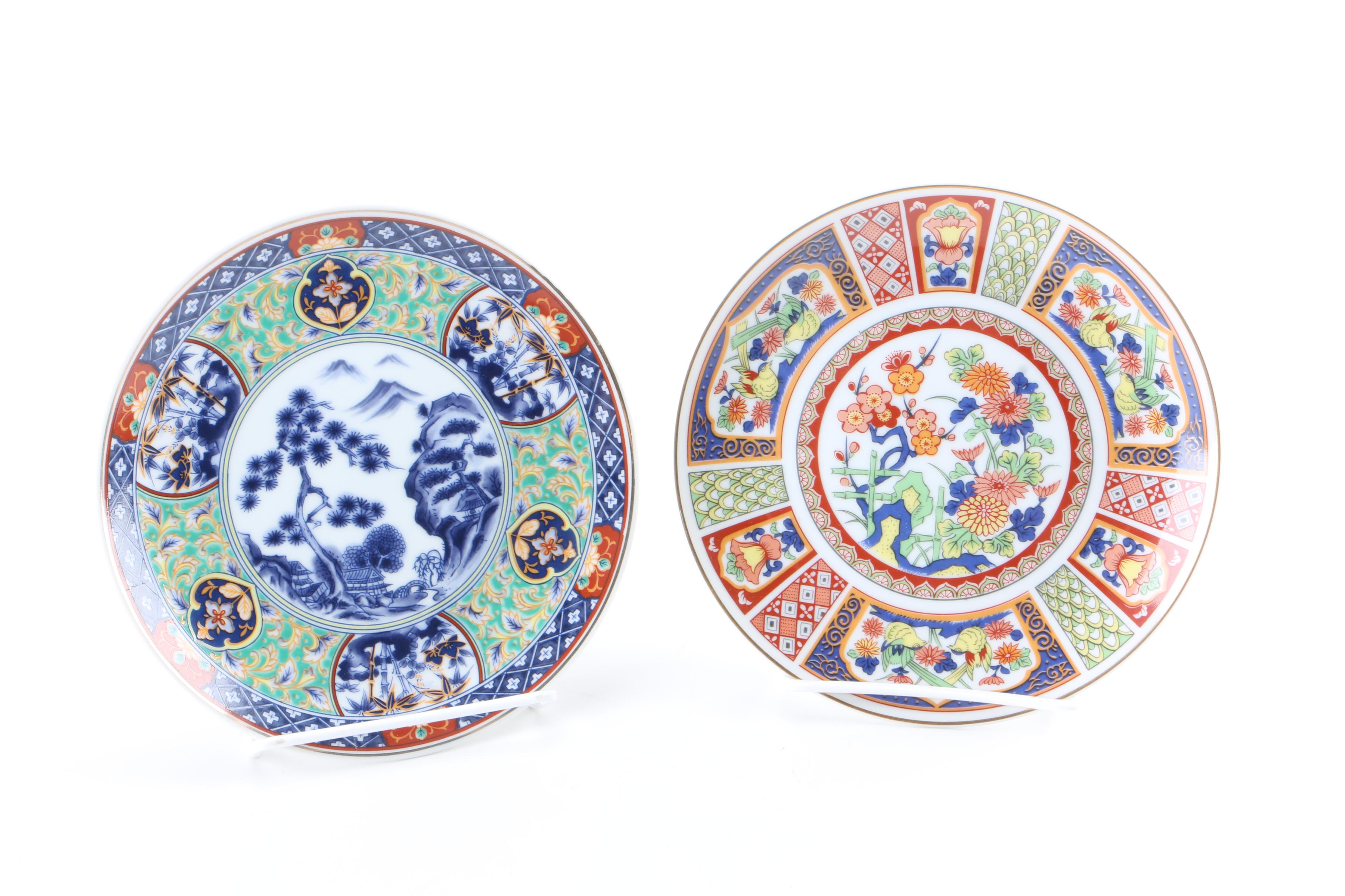 Assortment of Asian Themed Plates and Stands