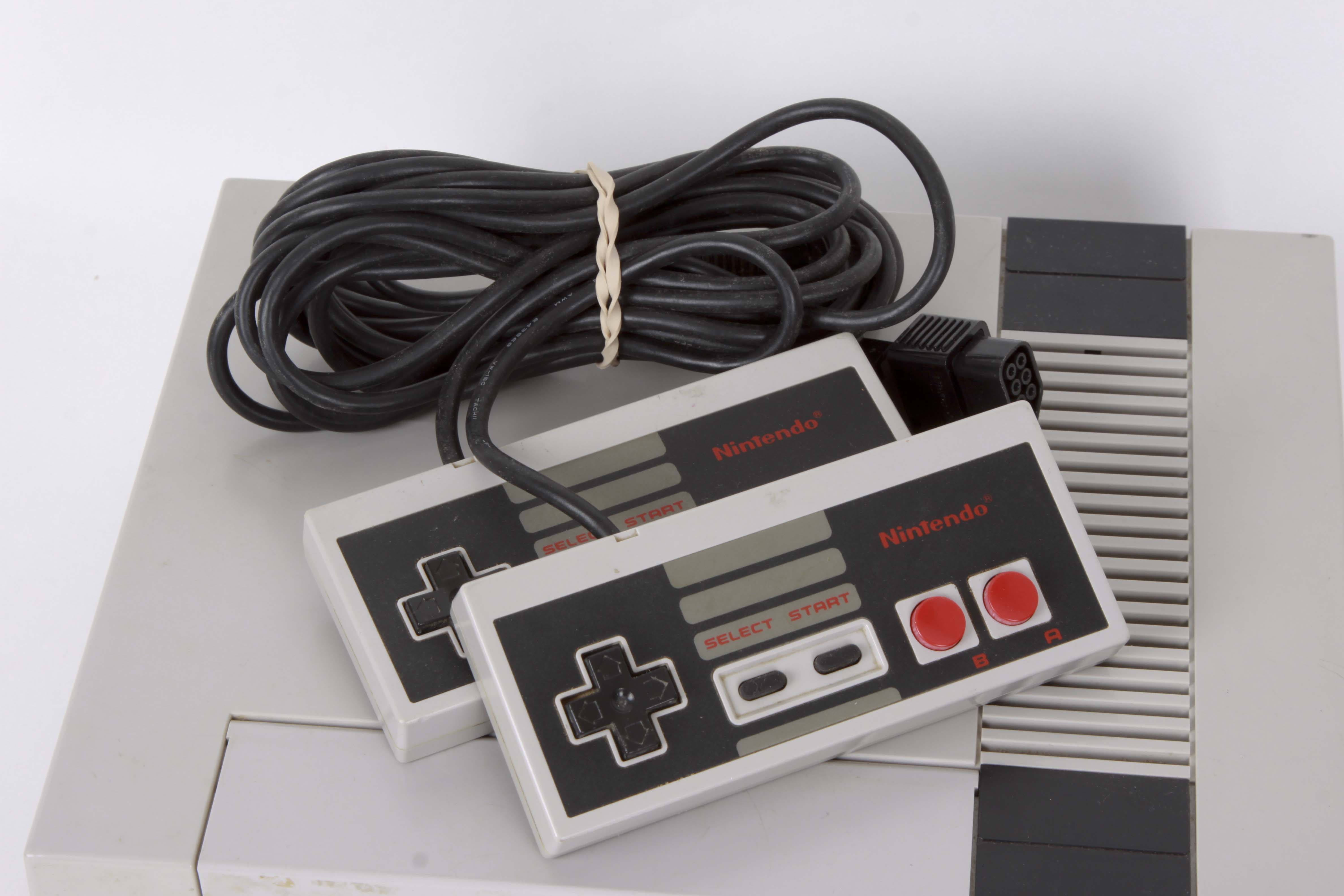 Vintage Nintendo NES System with Controllers and Games