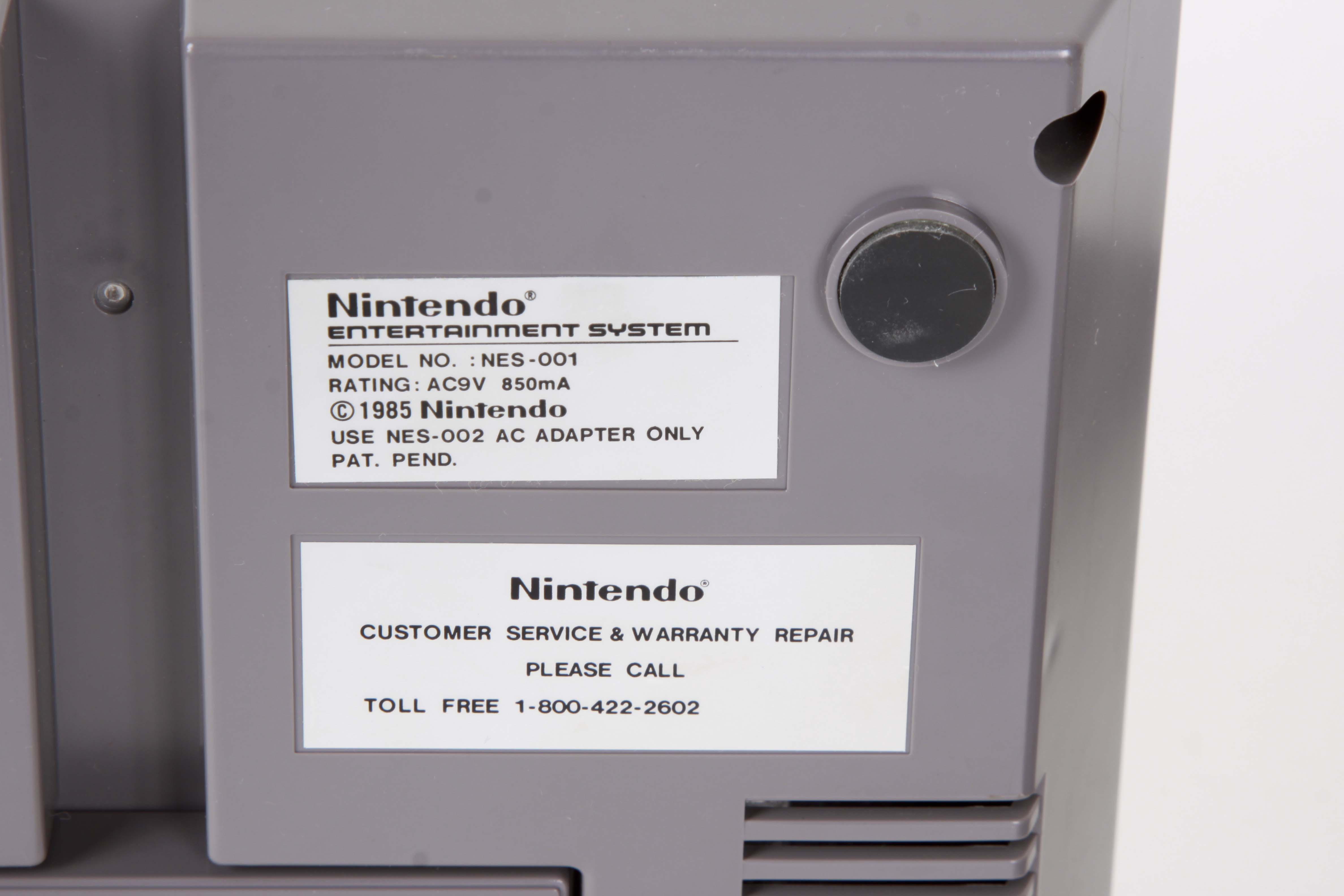 Vintage Nintendo NES System with Controllers and Games