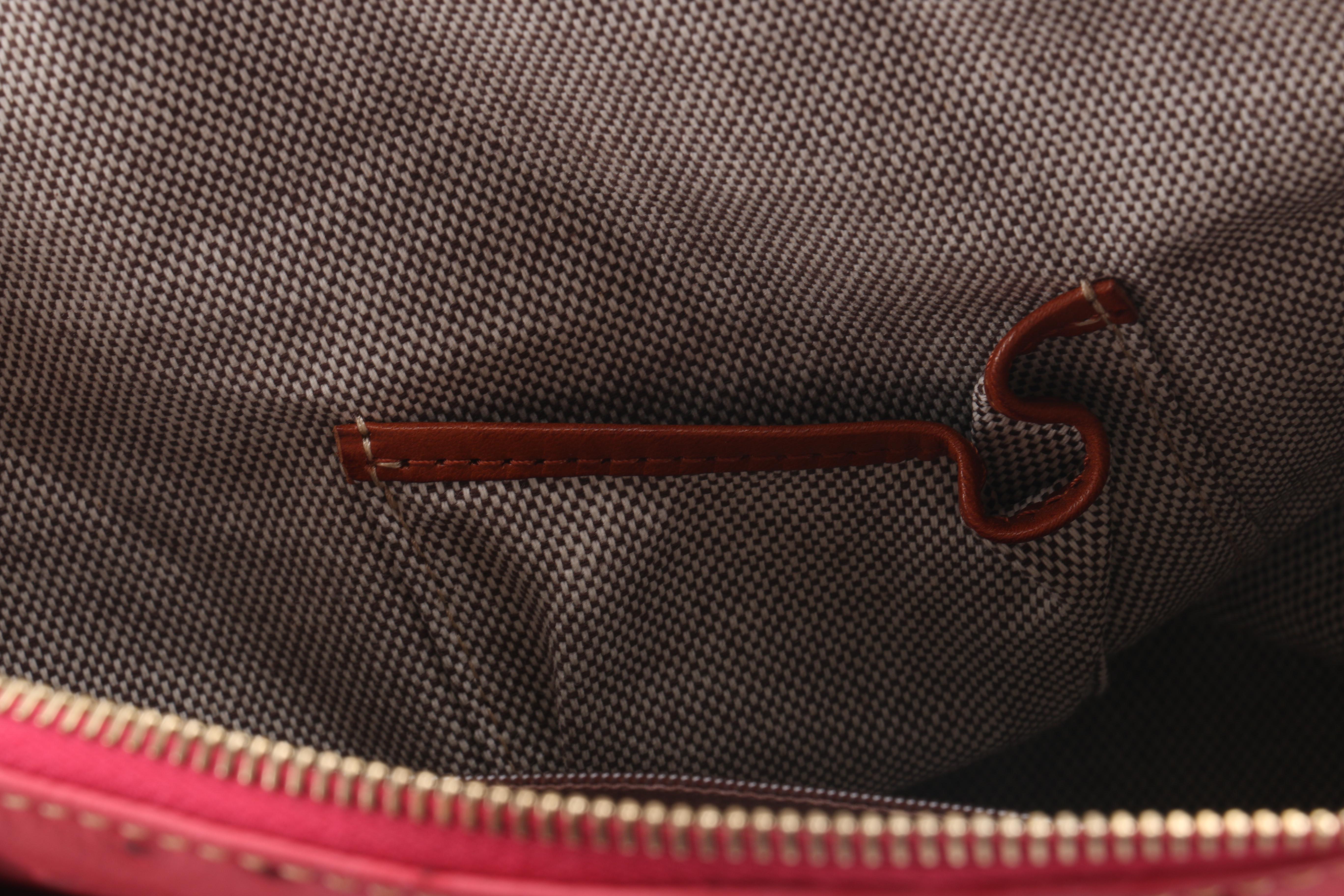 Dooney & Bourke Embossed Handbag