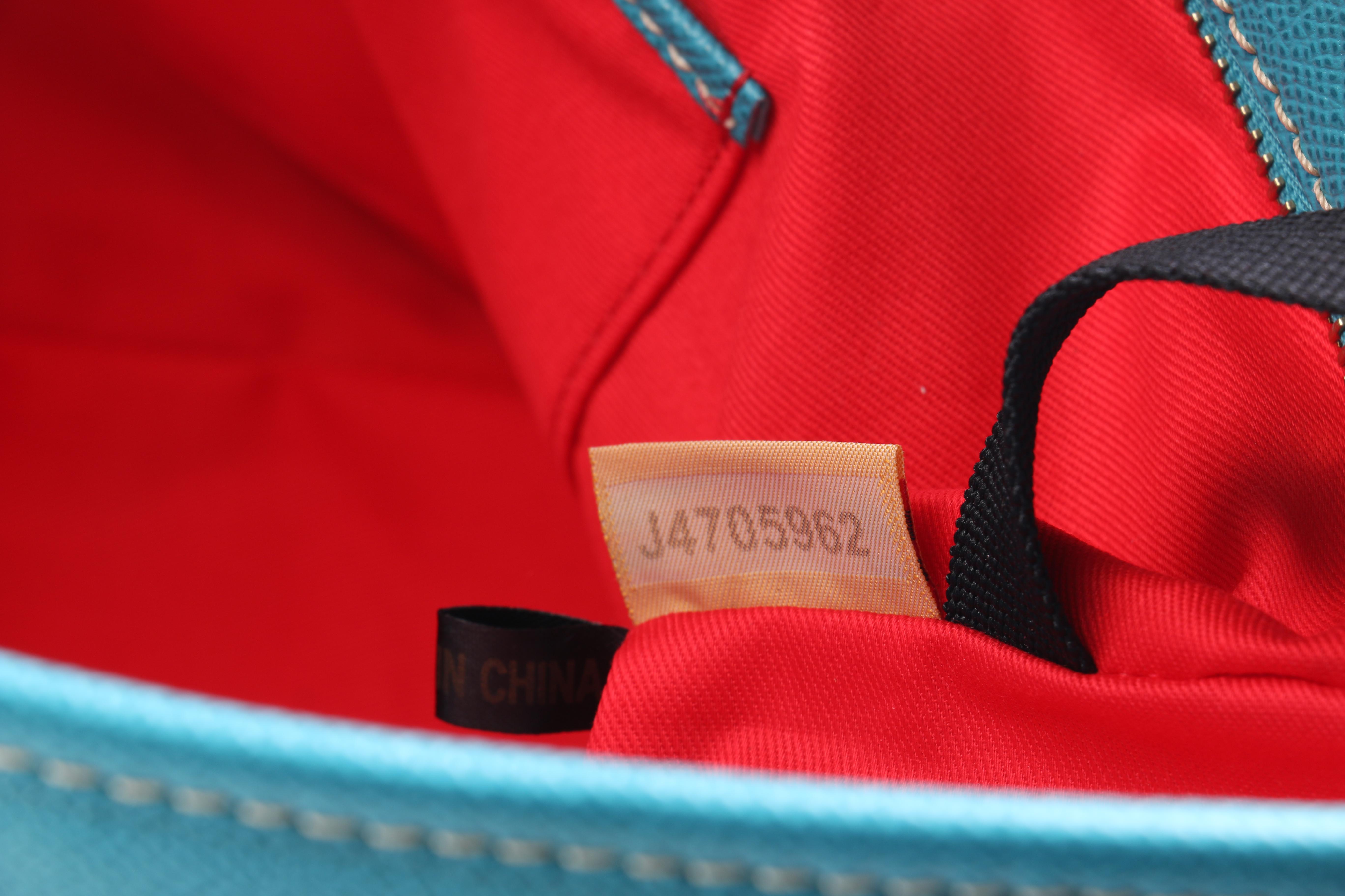 Dooney & Bourke Turquoise Leather Handbag