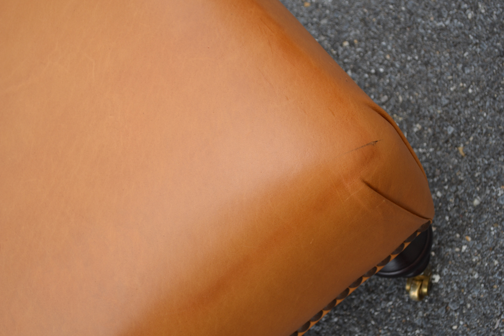 Dark Saffron Leather Armchair and Ottoman