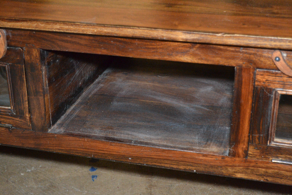 Dark Stained Wood Coffee Table With Glass Doors