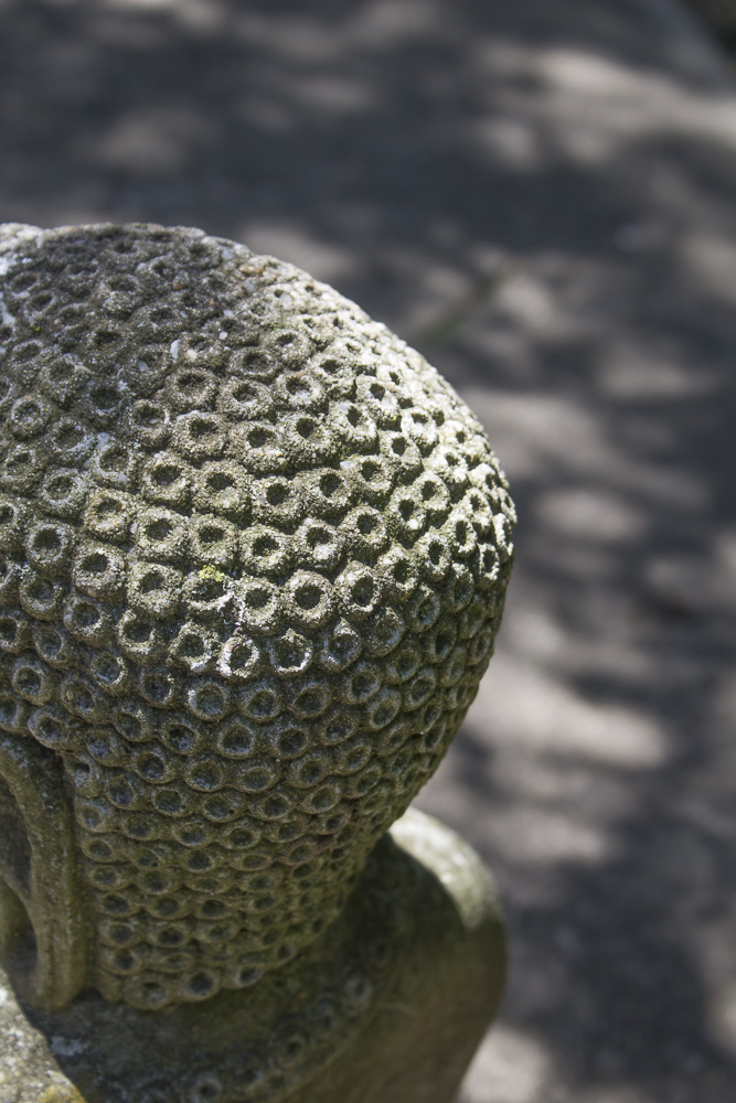 Seated Concrete Buddhist Figure