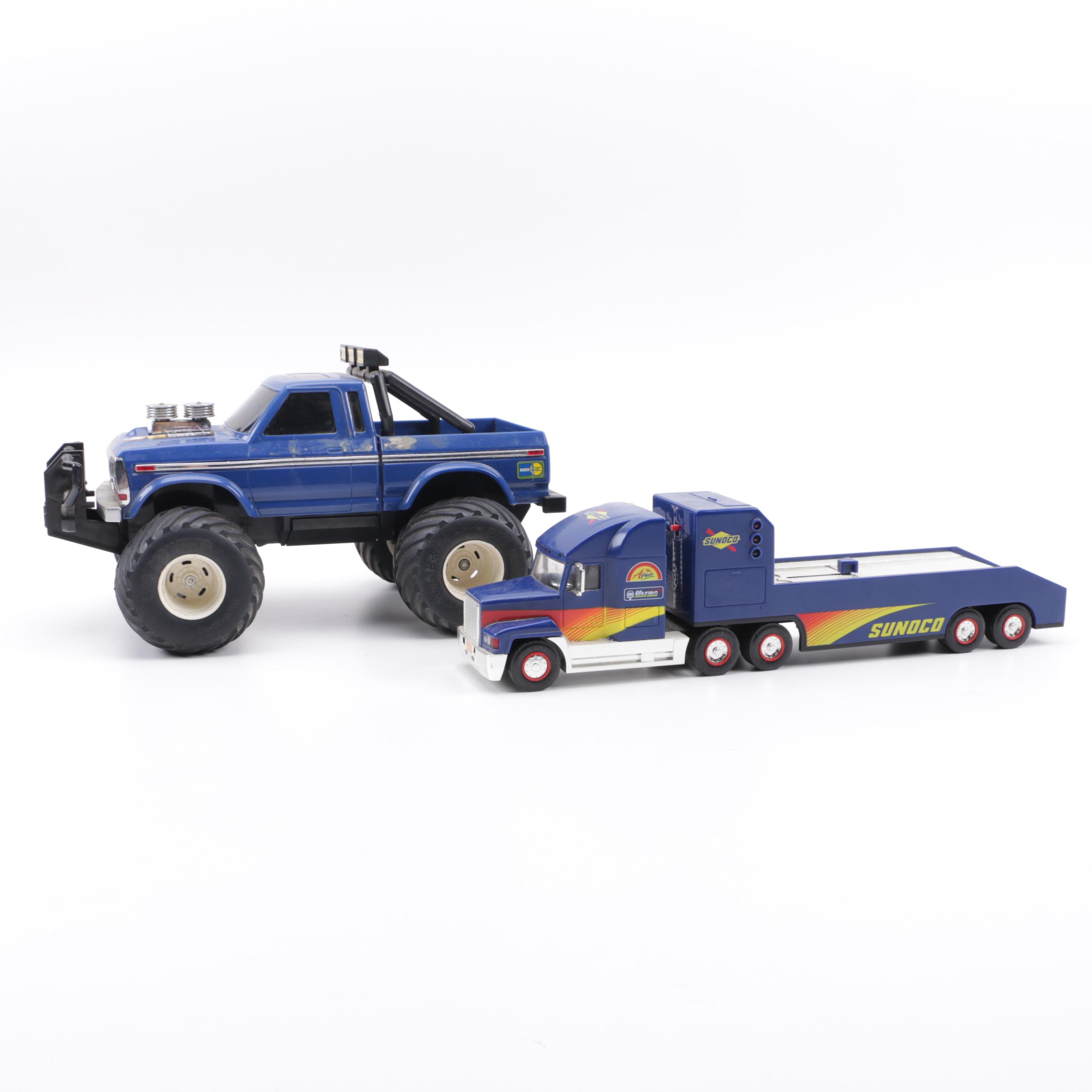 Two Blue Toy Trucks