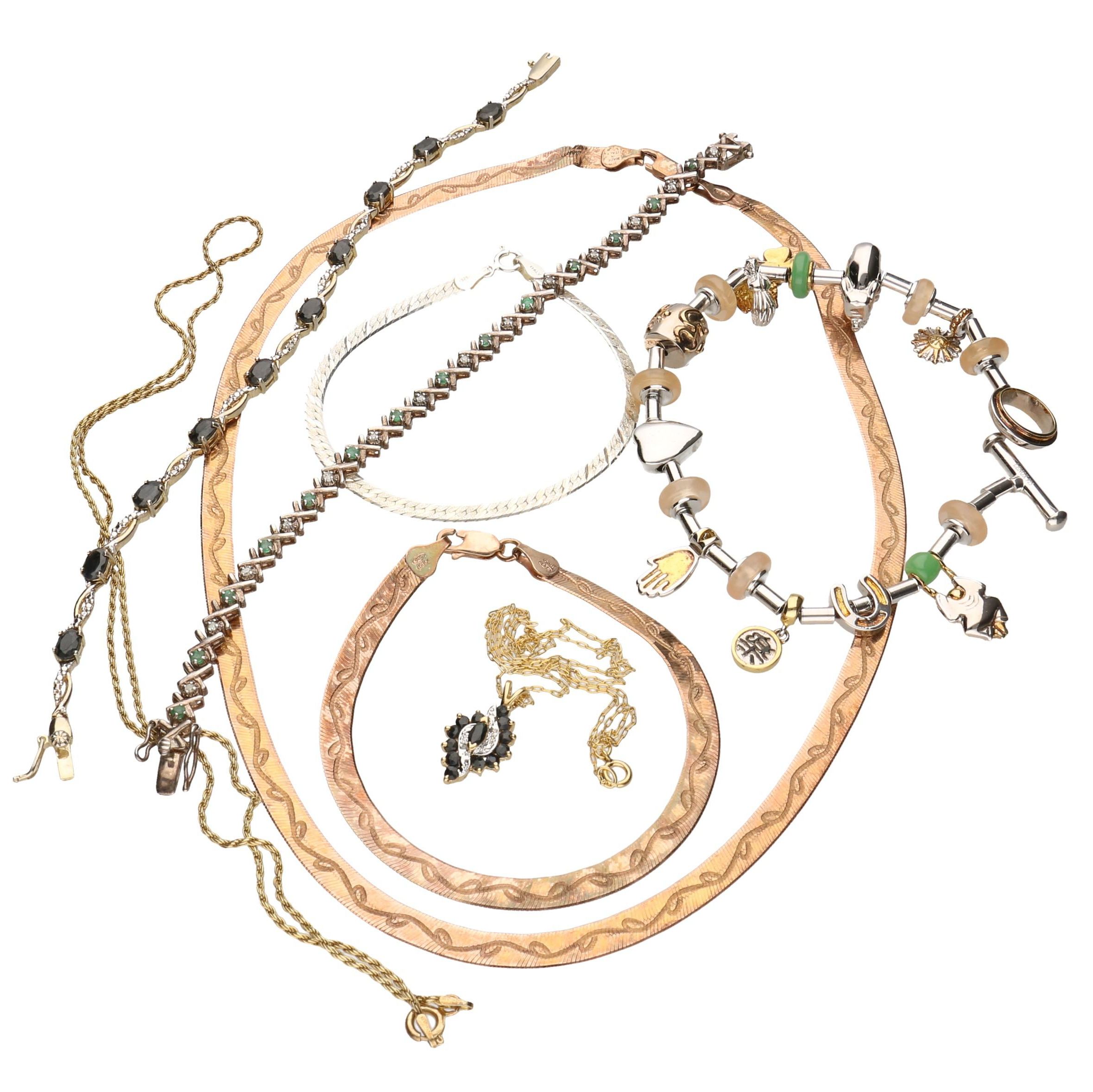 Assortment of Sterling Silver Jewelry Including Emeralds, Sapphires, and Diamonds