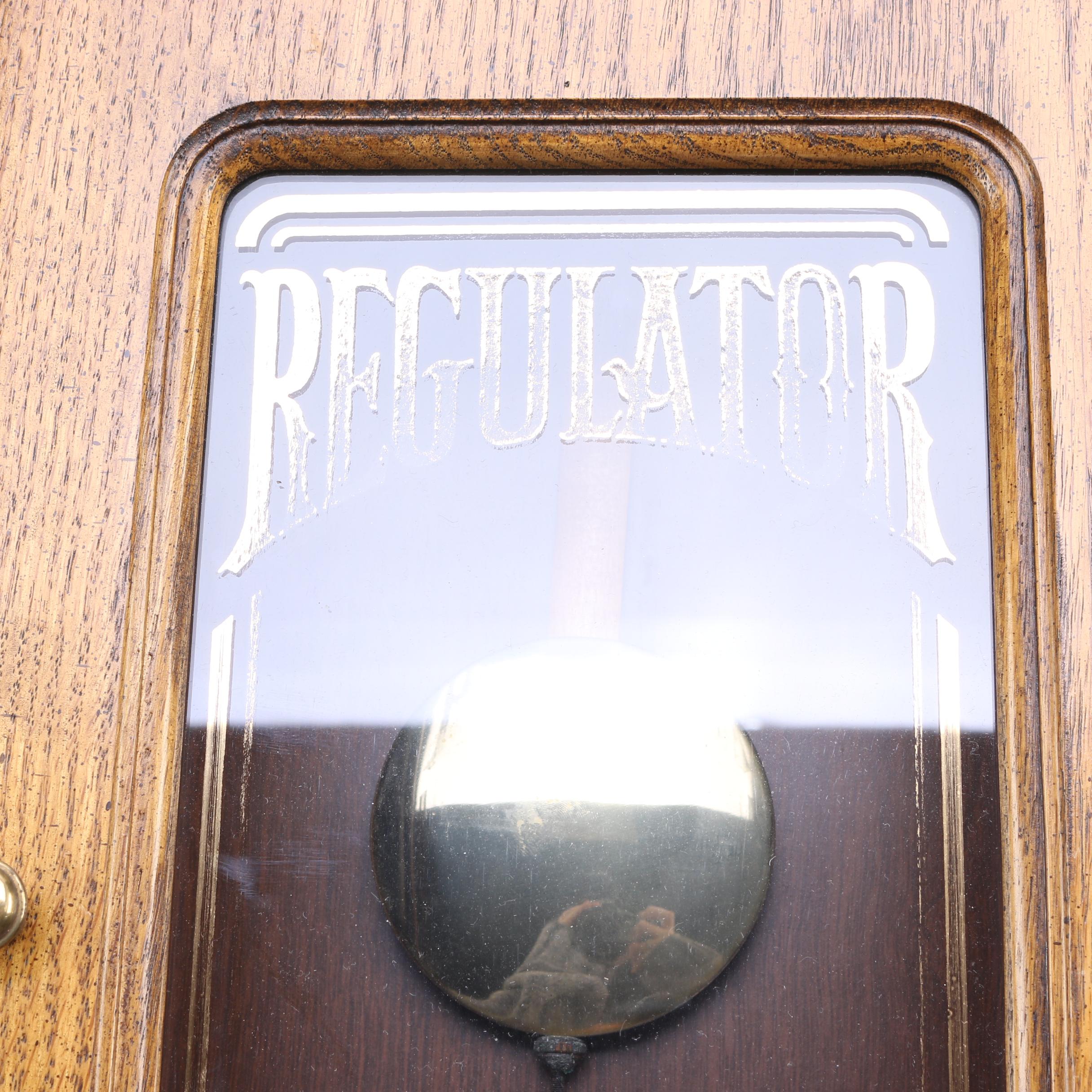 Howard Miller Wood Pendulum Wall Clock