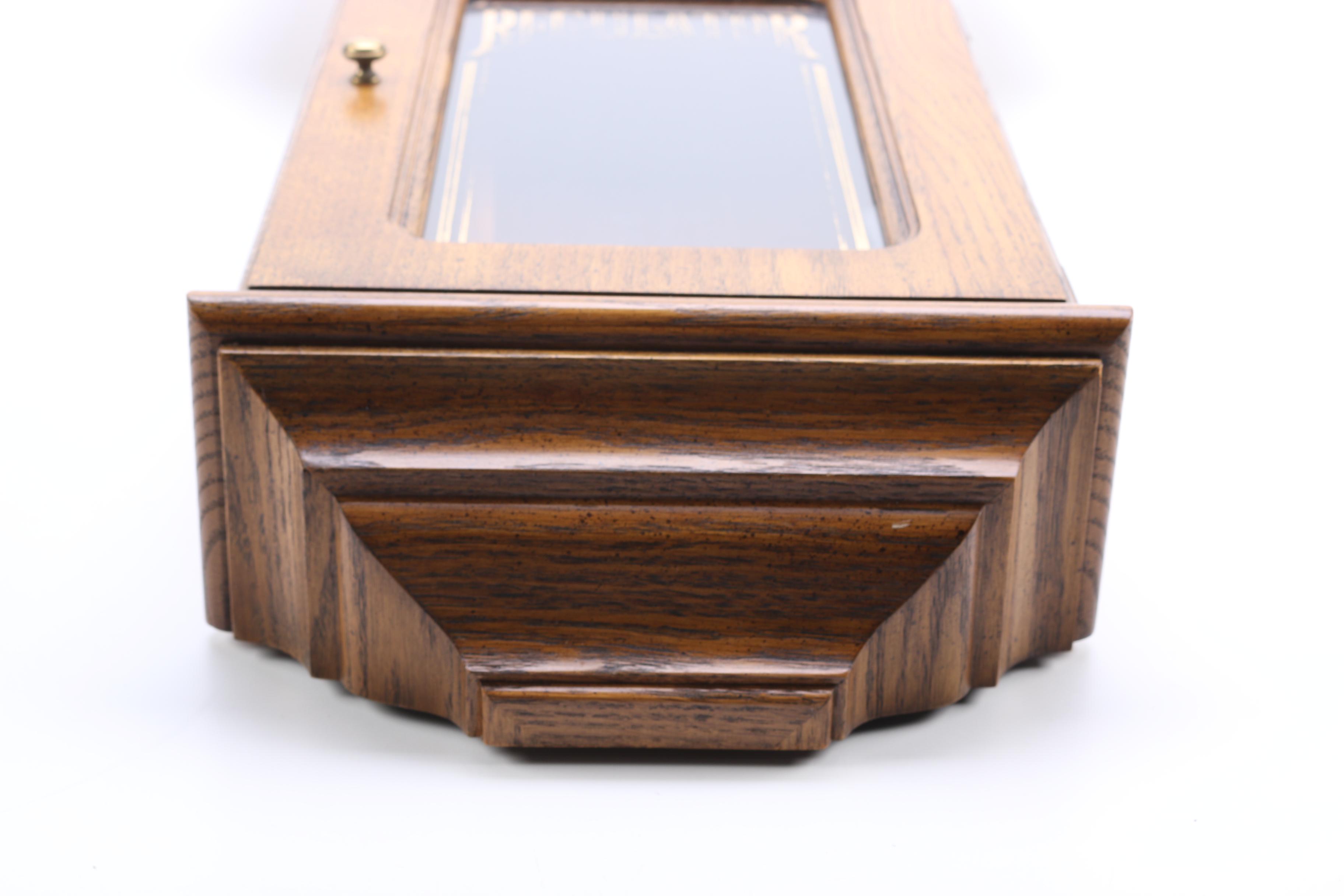 Howard Miller Wood Pendulum Wall Clock