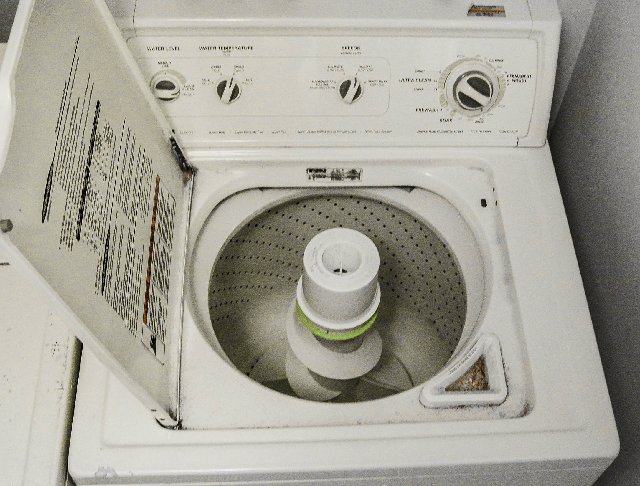 A Kenmore 80 Series Front Load Washer And Top Load Dryer Set