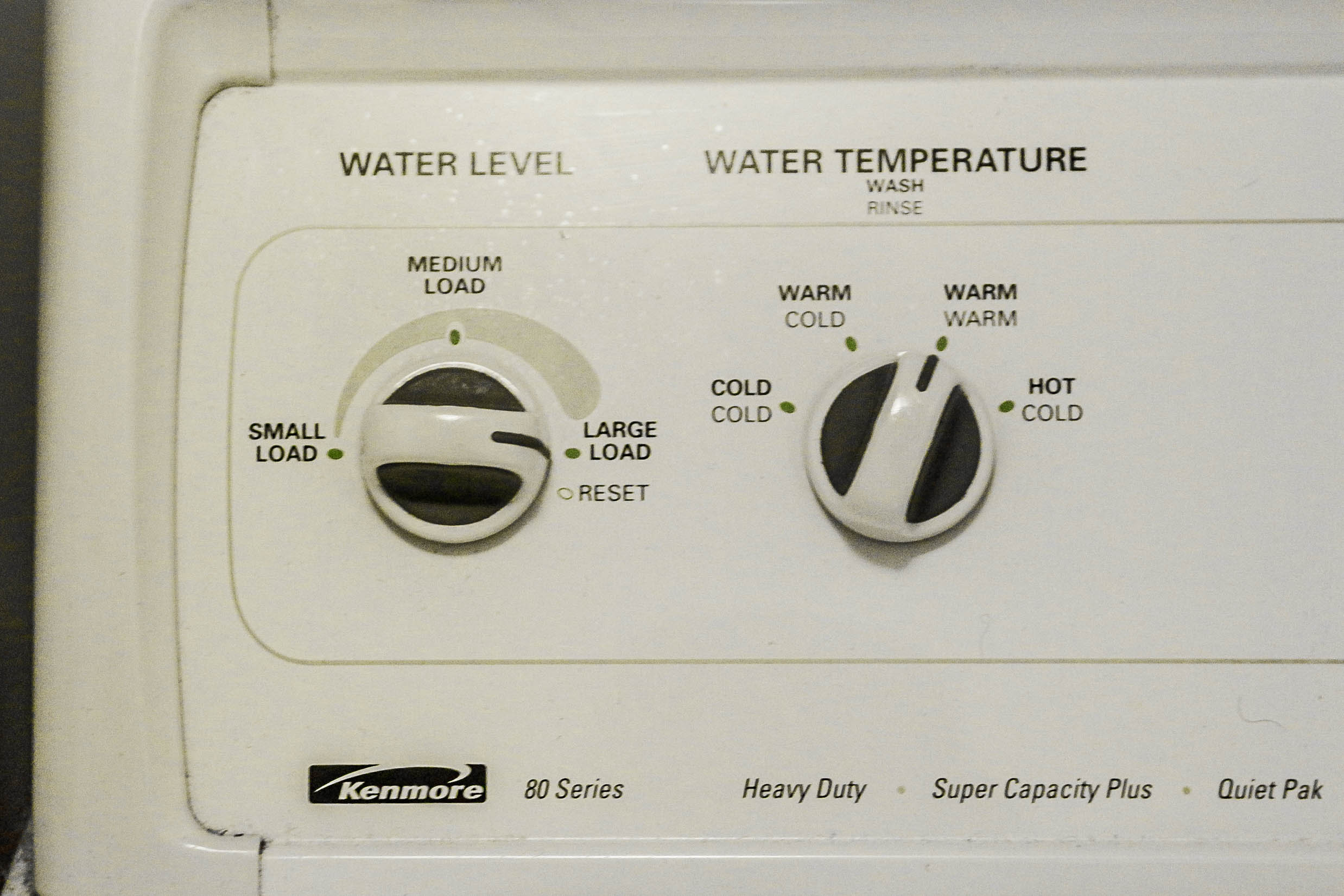 A Kenmore 80 Series Front Load Washer And Top Load Dryer Set