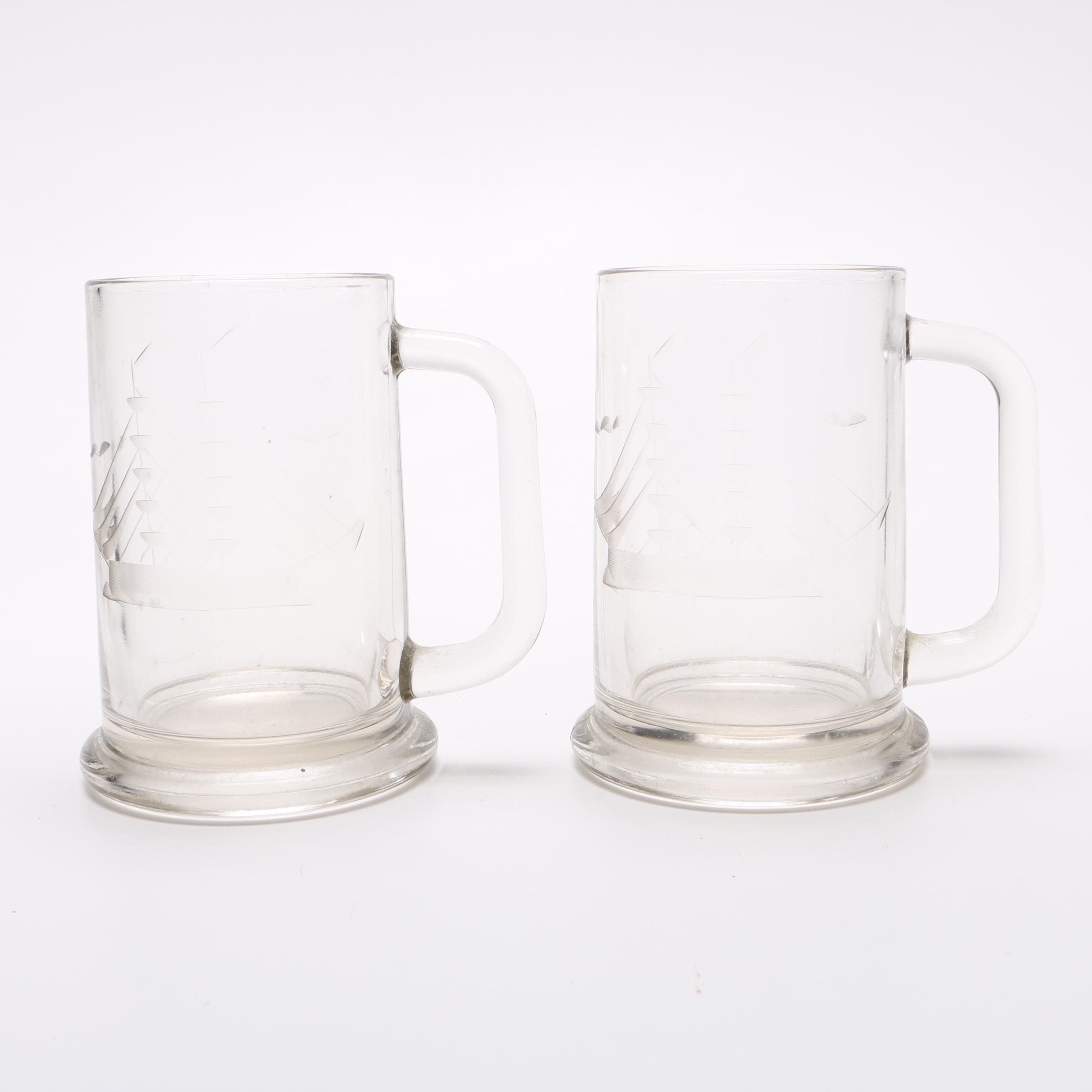 Glass decanter and two beer mugs