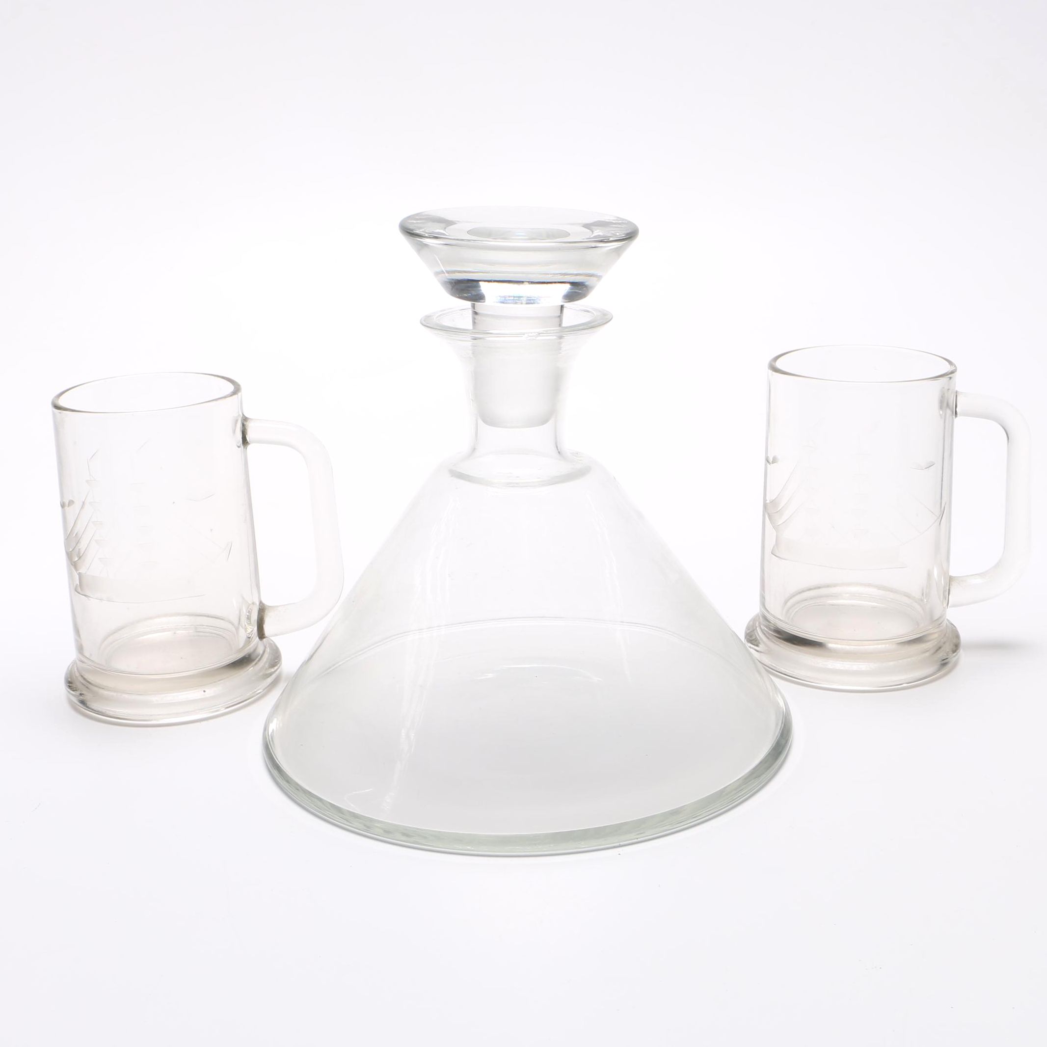 Glass decanter and two beer mugs