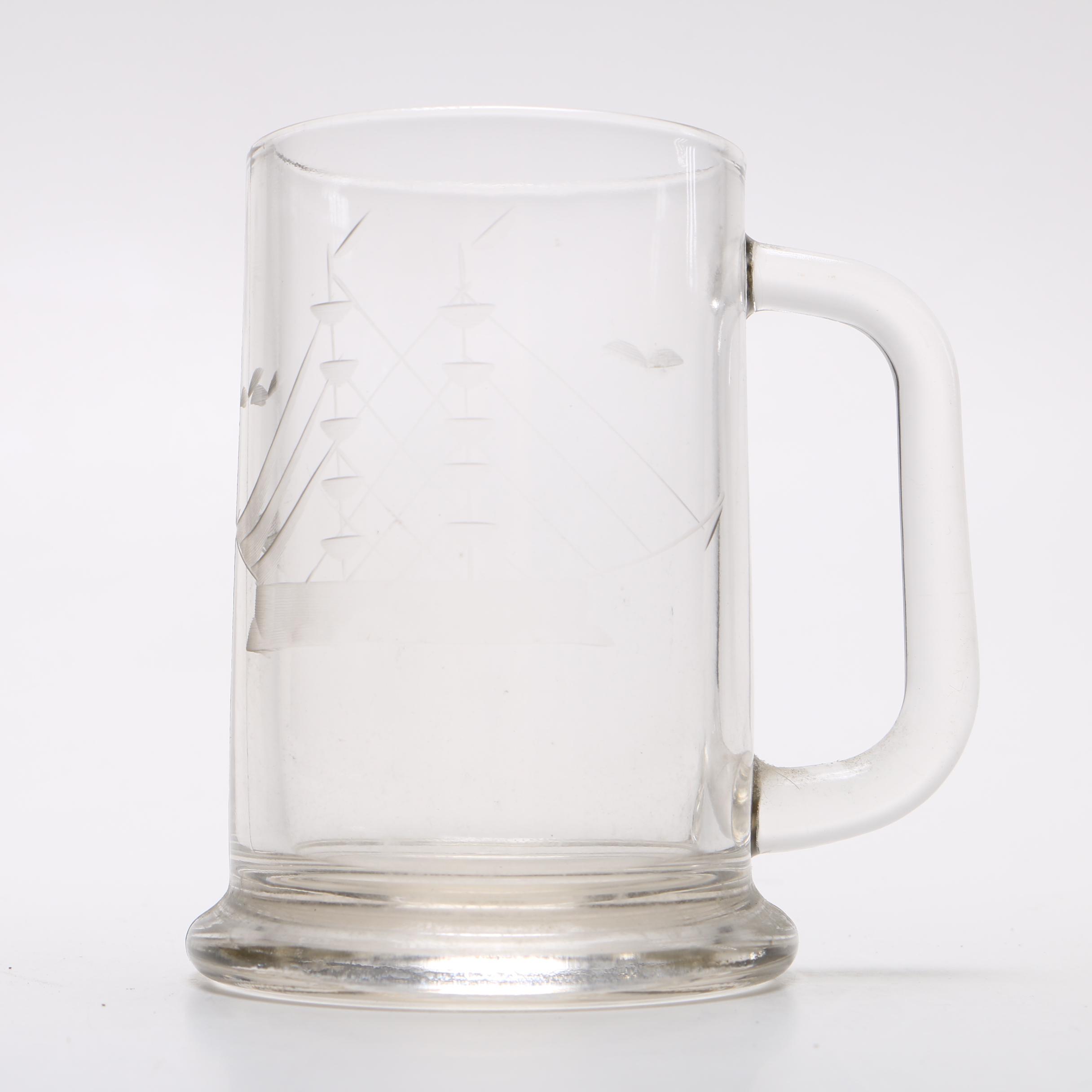 Glass decanter and two beer mugs