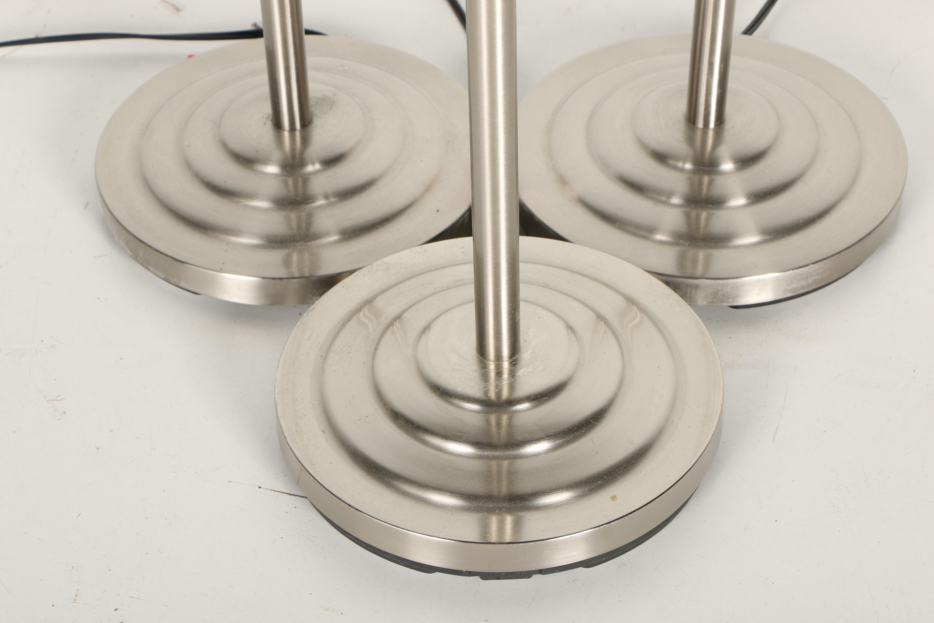 Three Stainless Steel Floor Torchiere Lamps