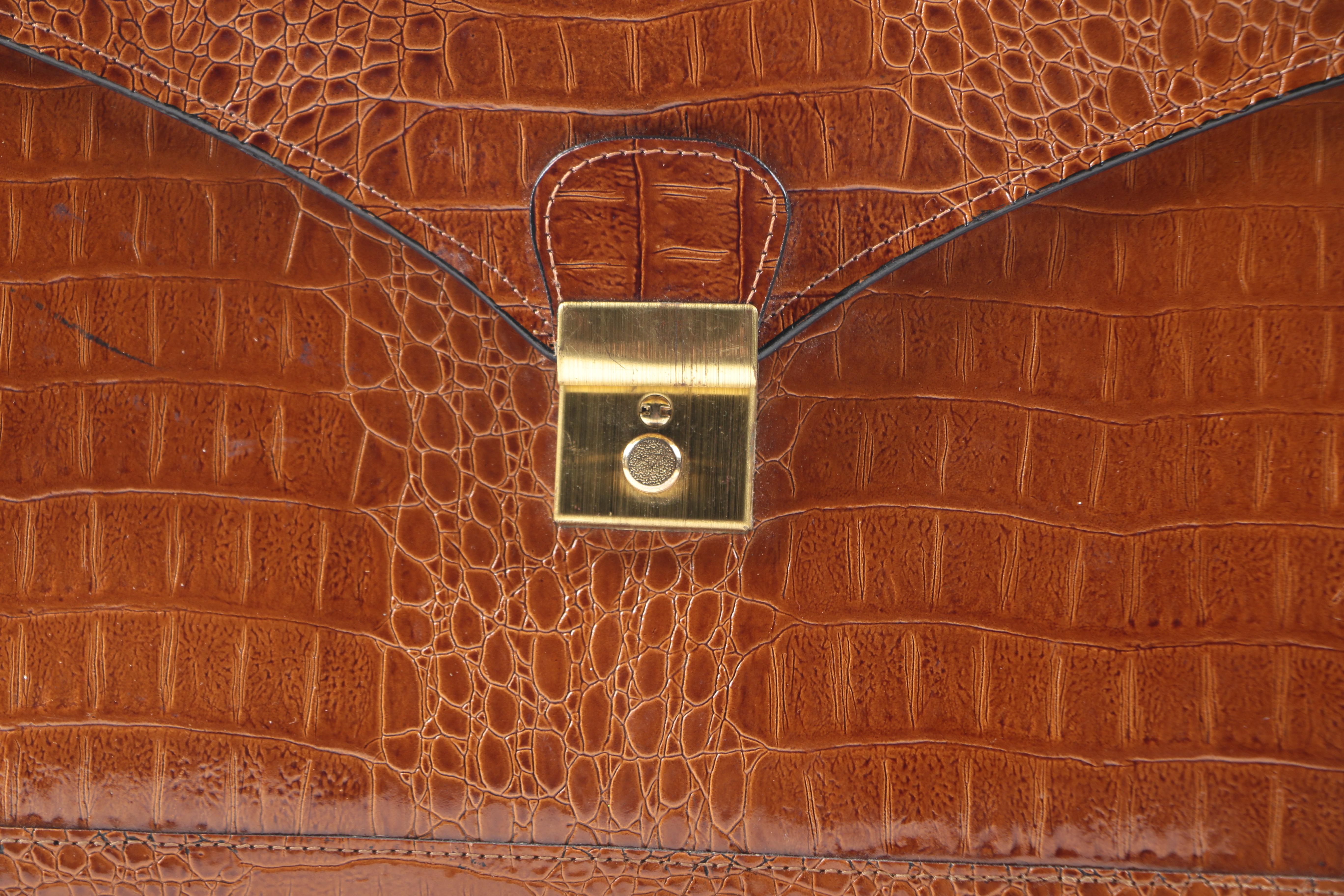 Embossed Leather Briefcase and Alligator Clutch