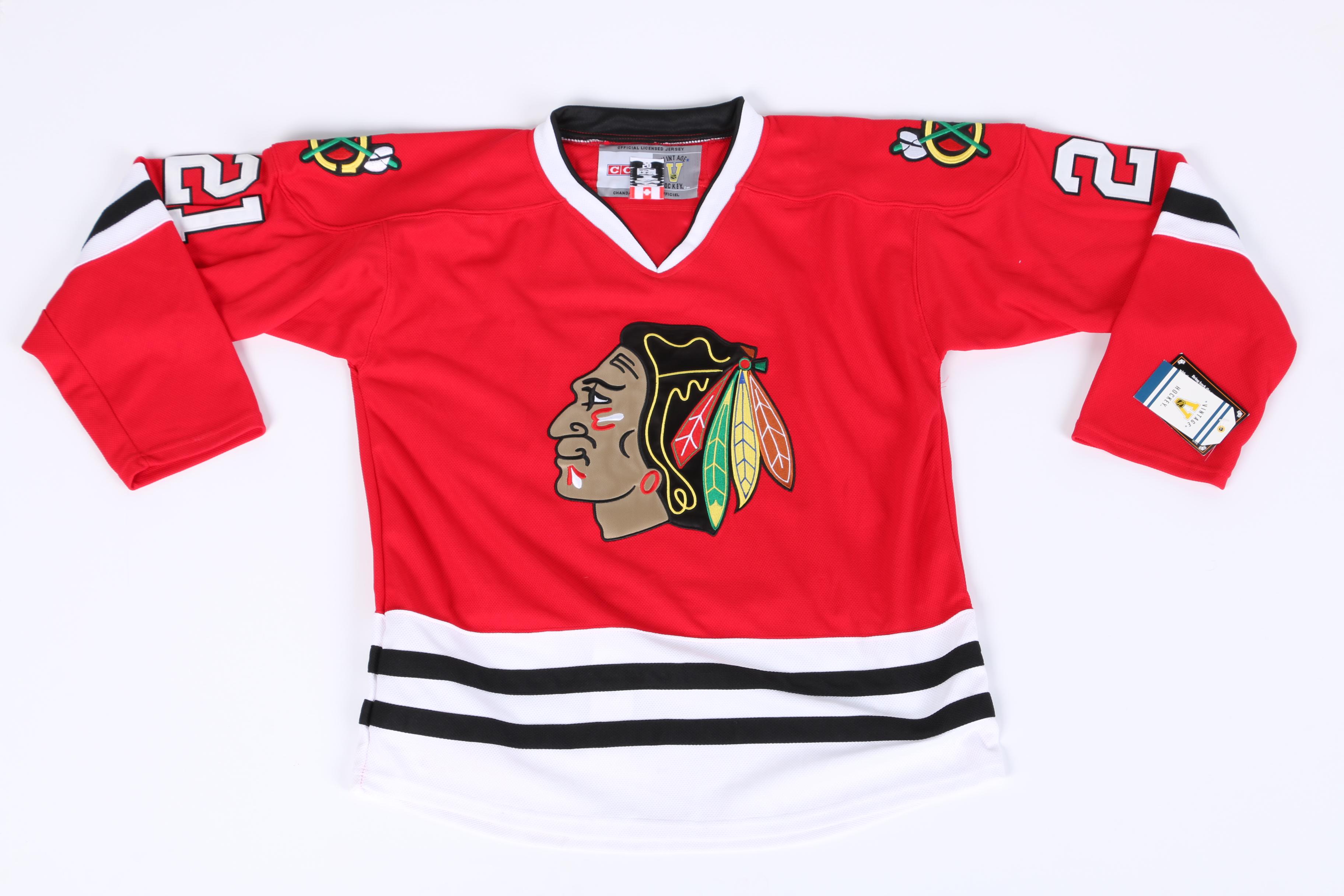 Stan Mikita Signed Jersey and Puck