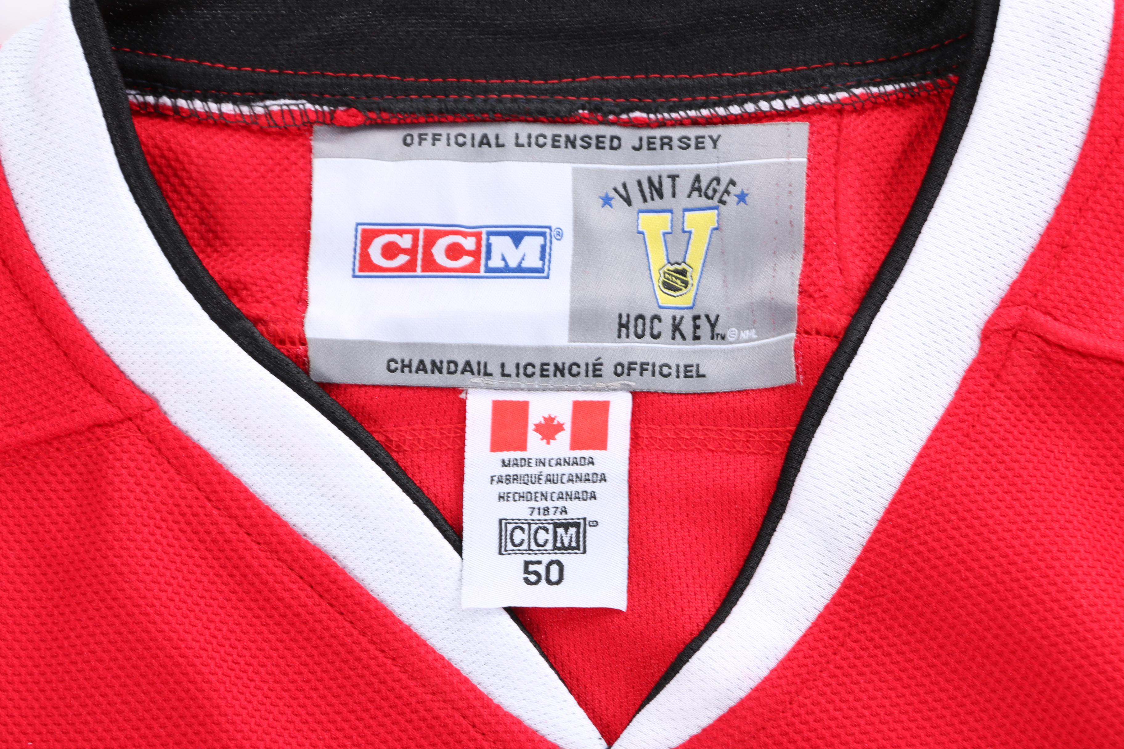 Stan Mikita Signed Jersey and Puck