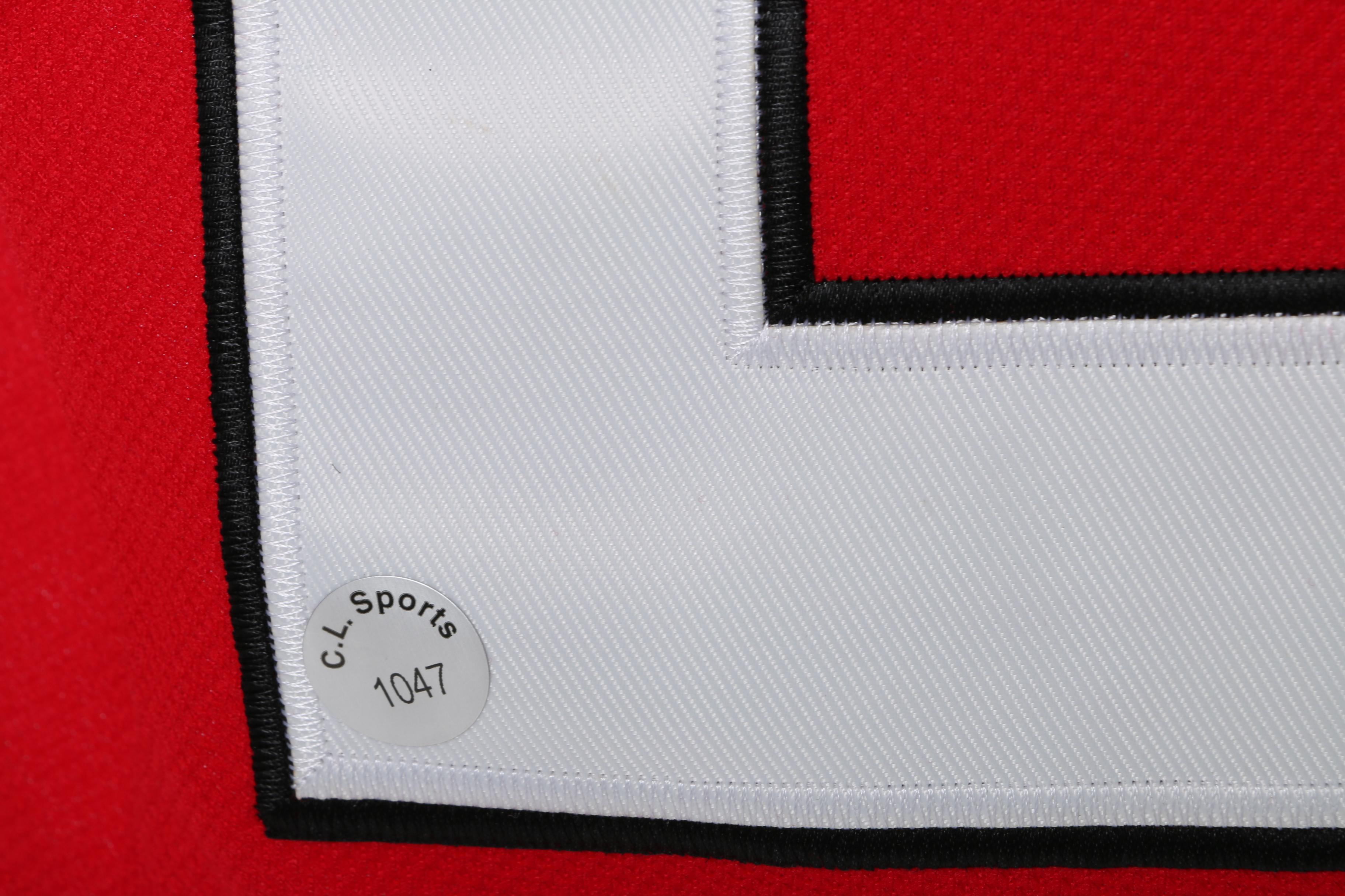 Stan Mikita Signed Jersey and Puck