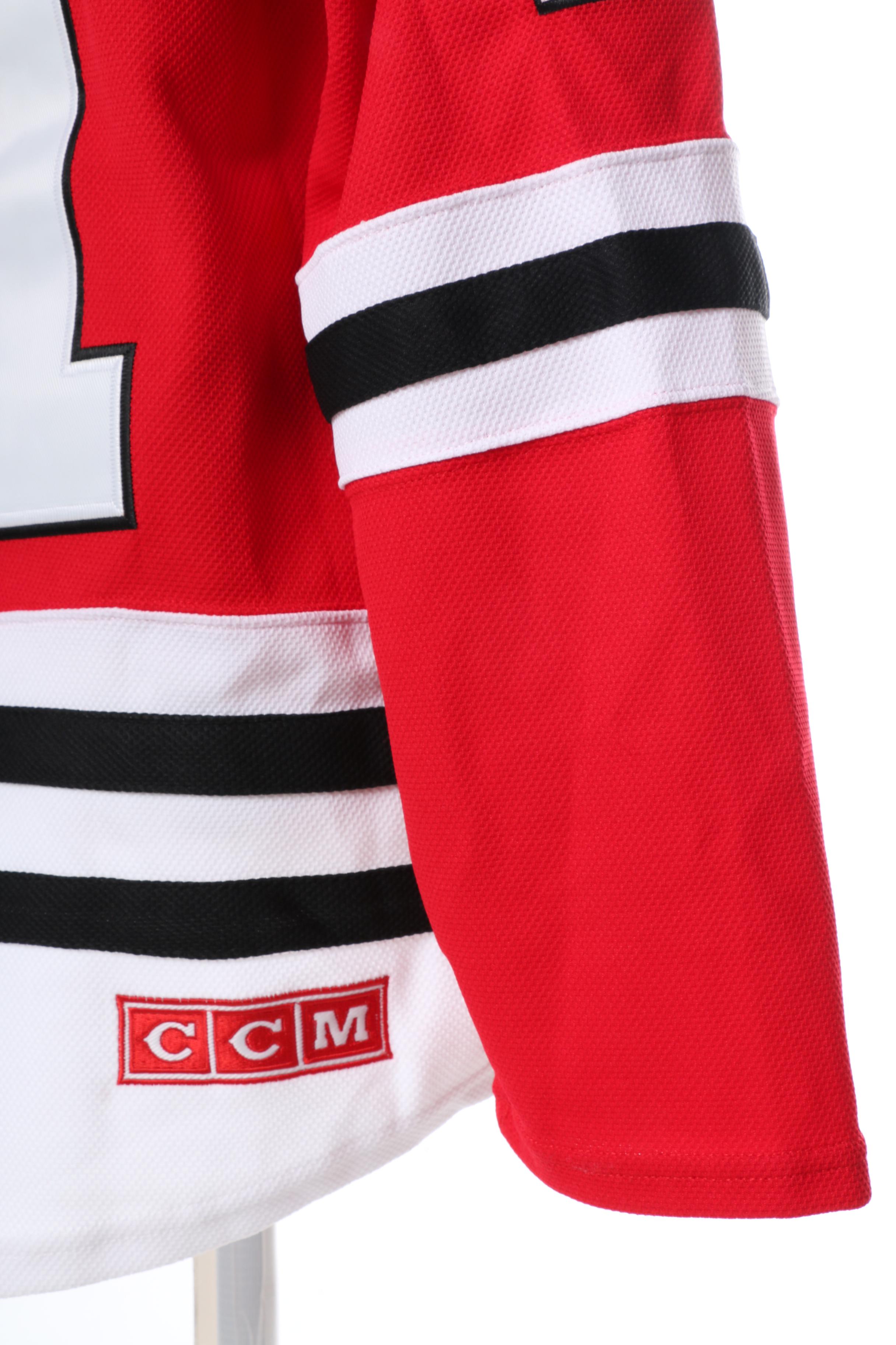 Stan Mikita Signed Jersey and Puck