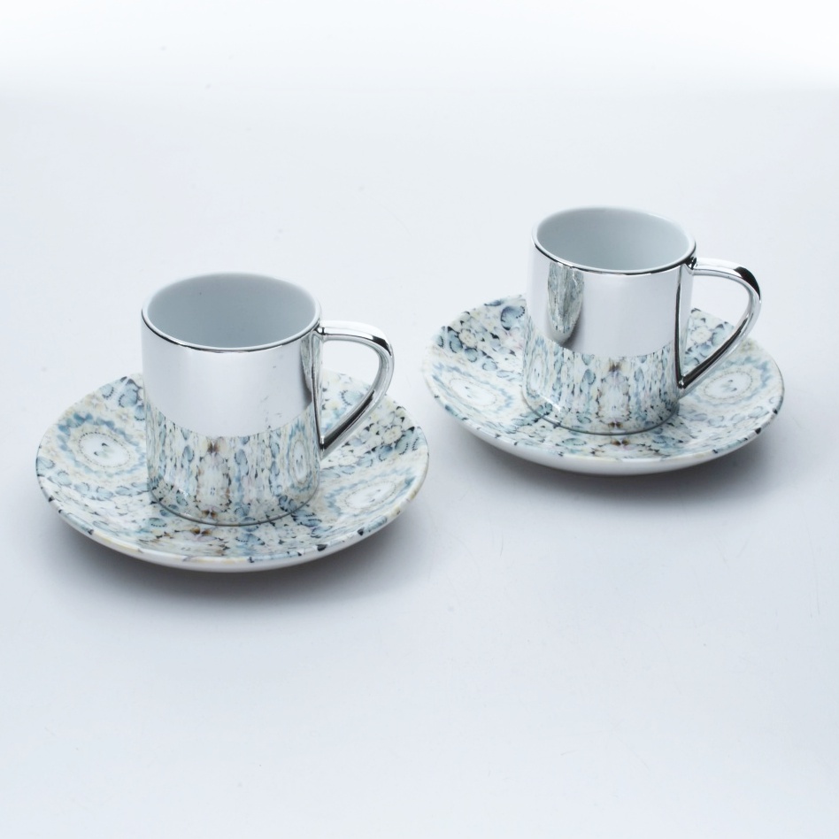Four Damien Hirst "Virtue" Electroplated Cups and Saucers