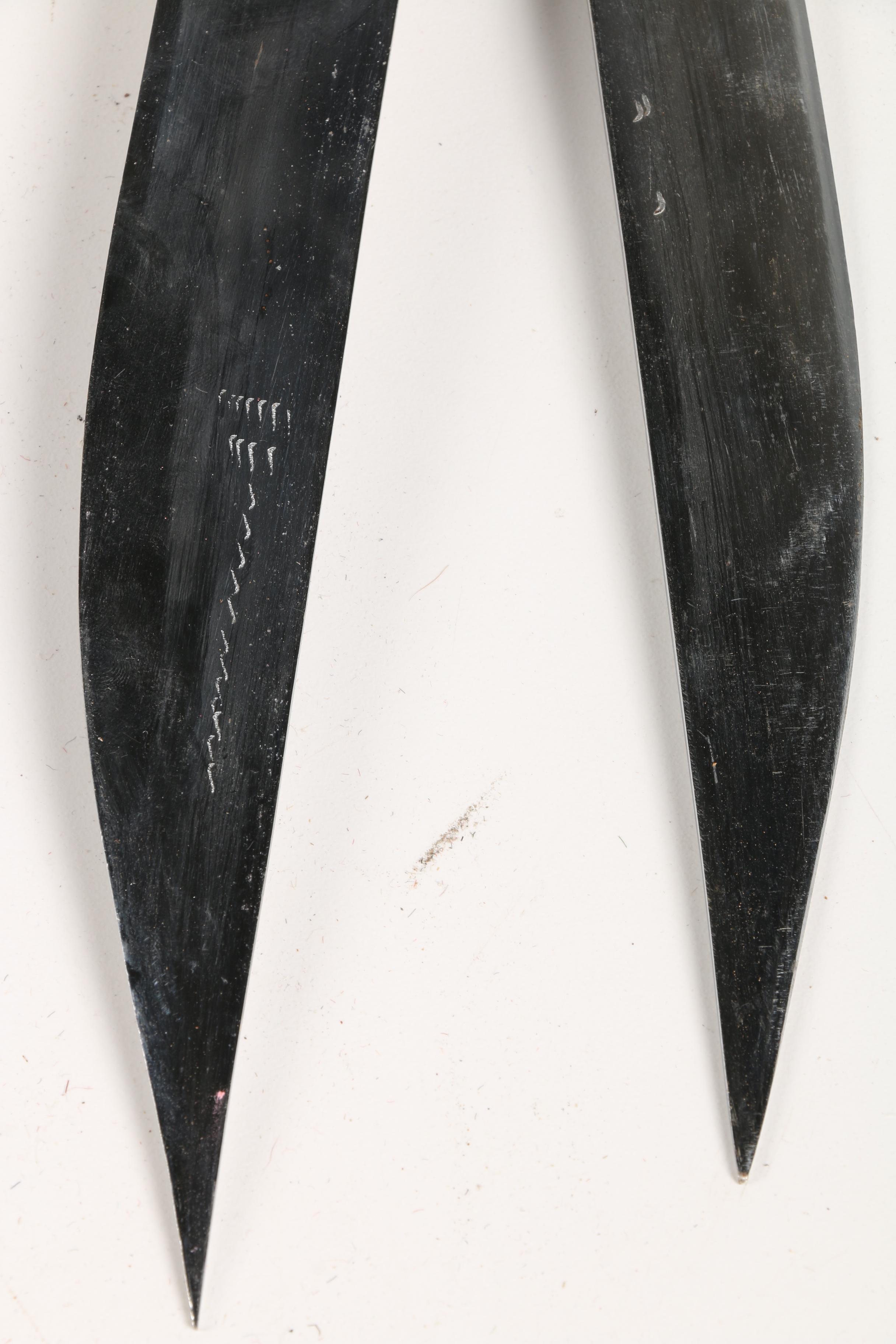Sword Pair with Carved Handles and Scabbards