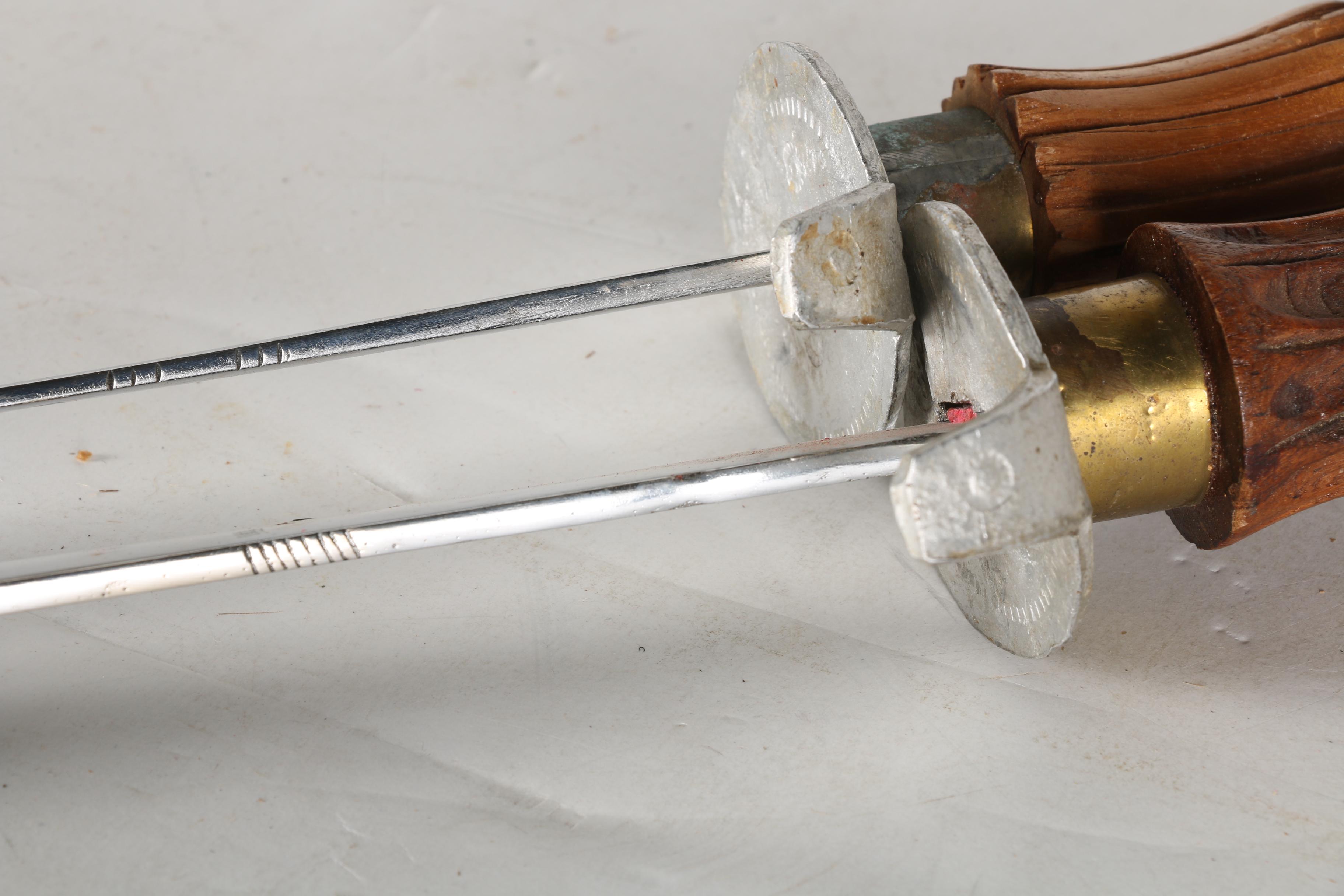 Sword Pair with Carved Handles and Scabbards