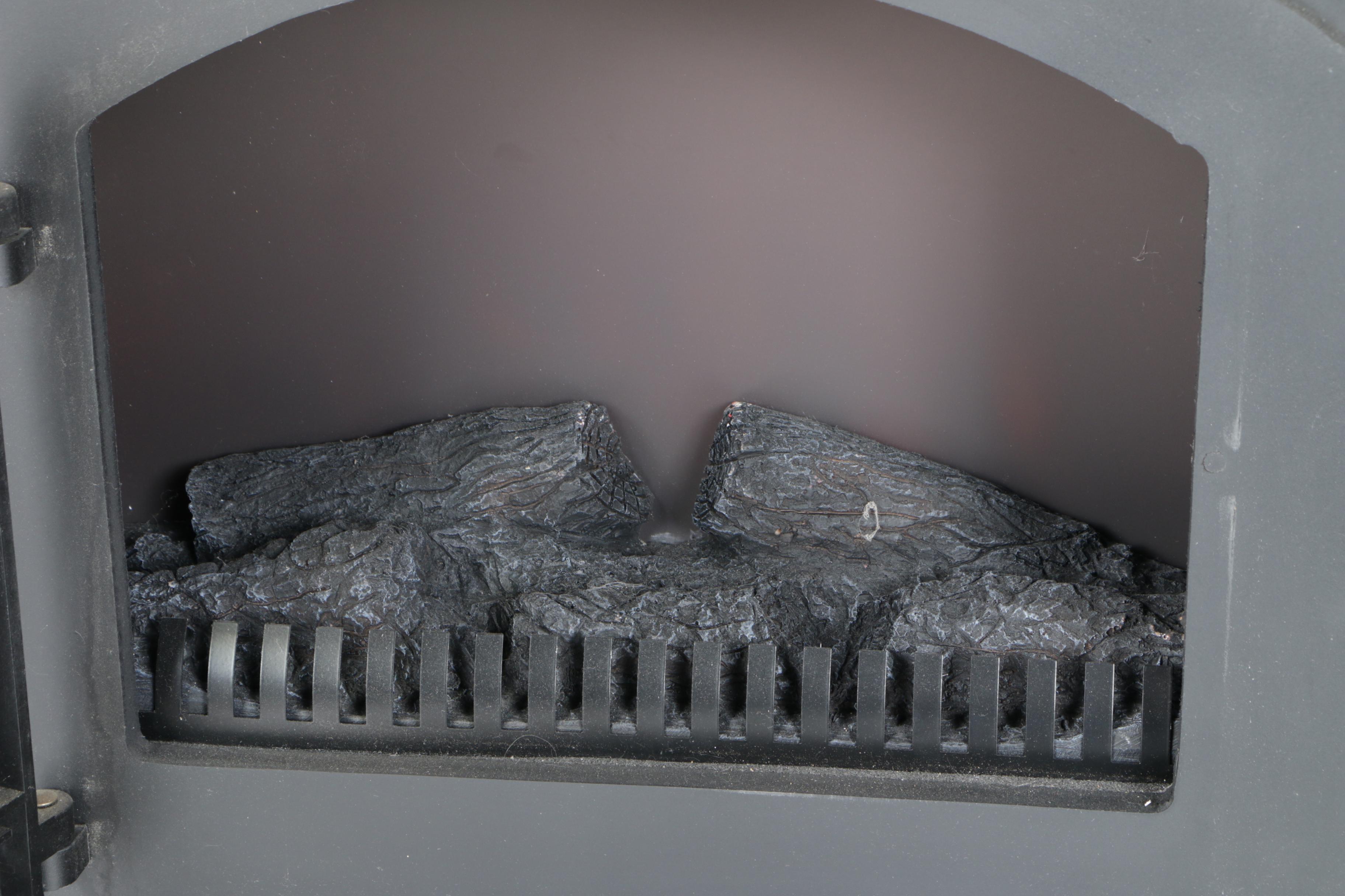 Black Wood Stove and Andirons