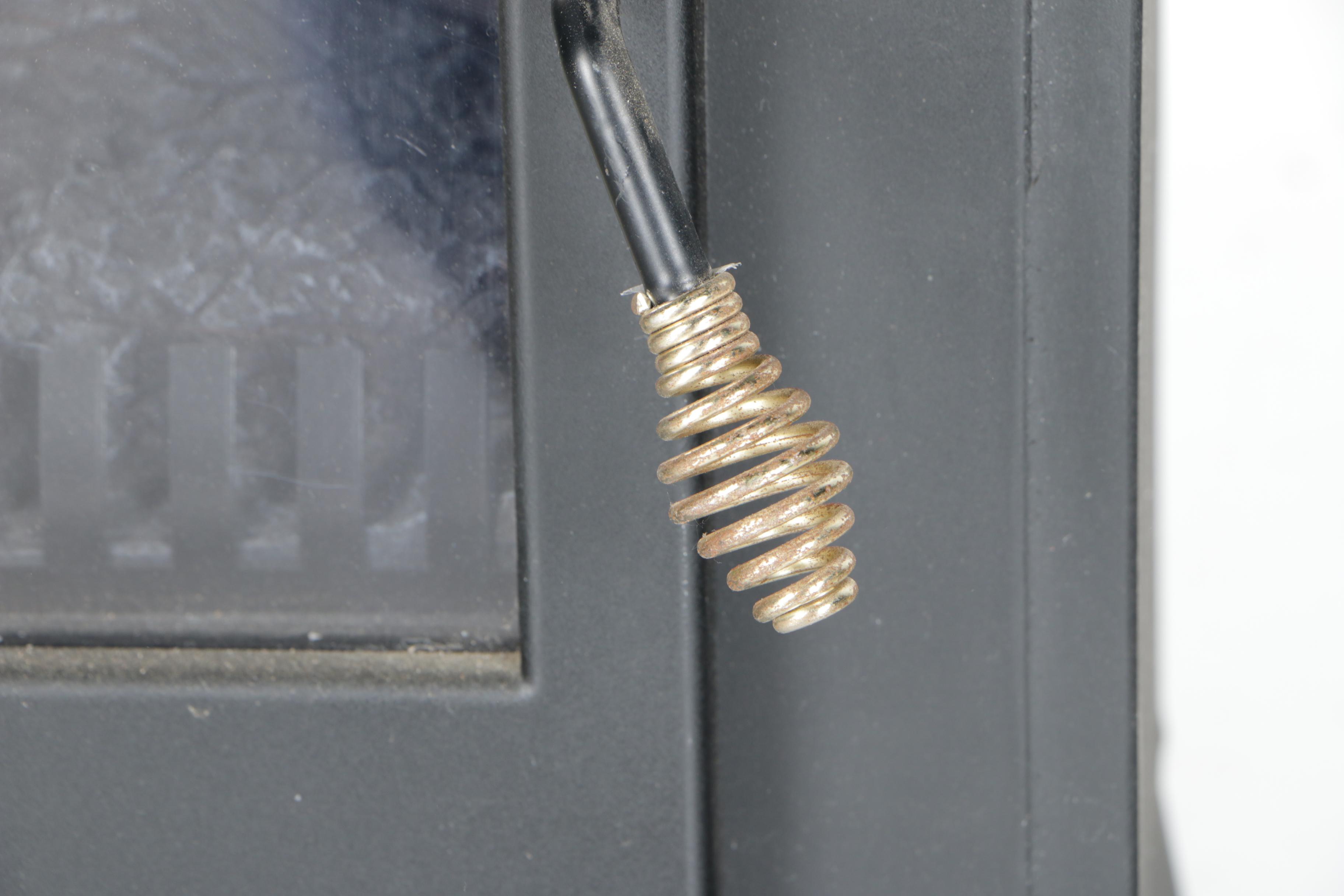 Black Wood Stove and Andirons