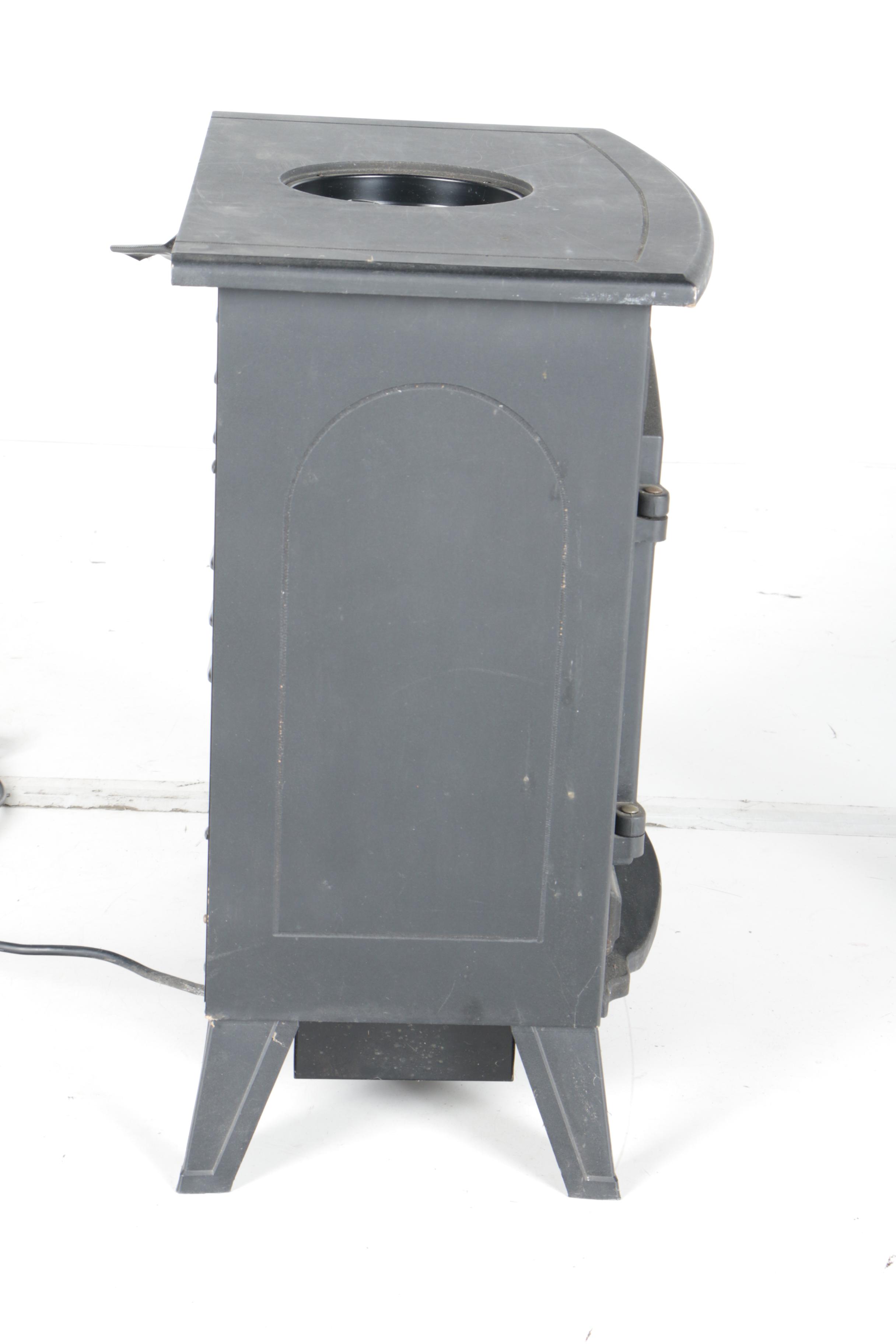 Black Wood Stove and Andirons