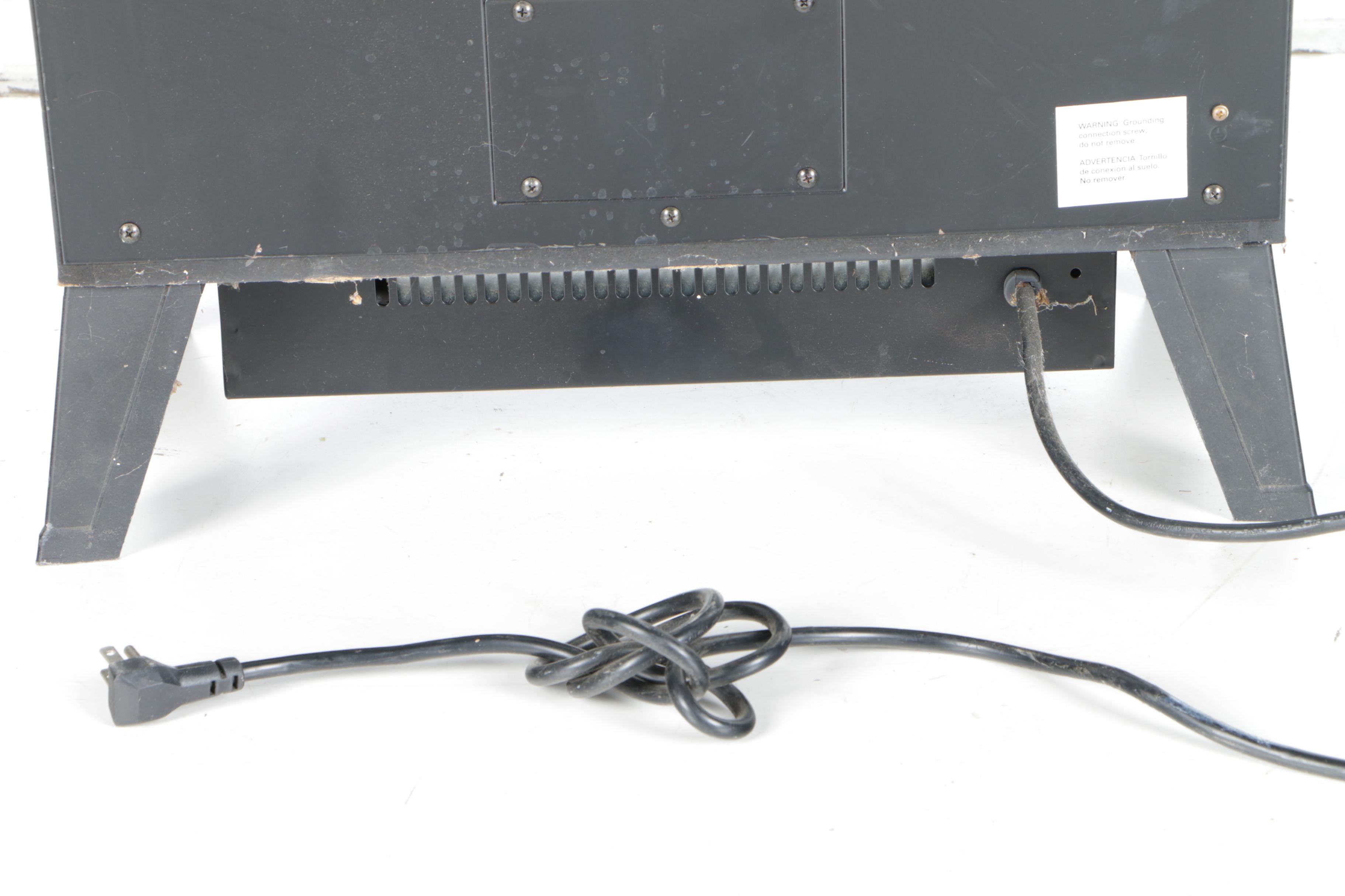 Black Wood Stove and Andirons