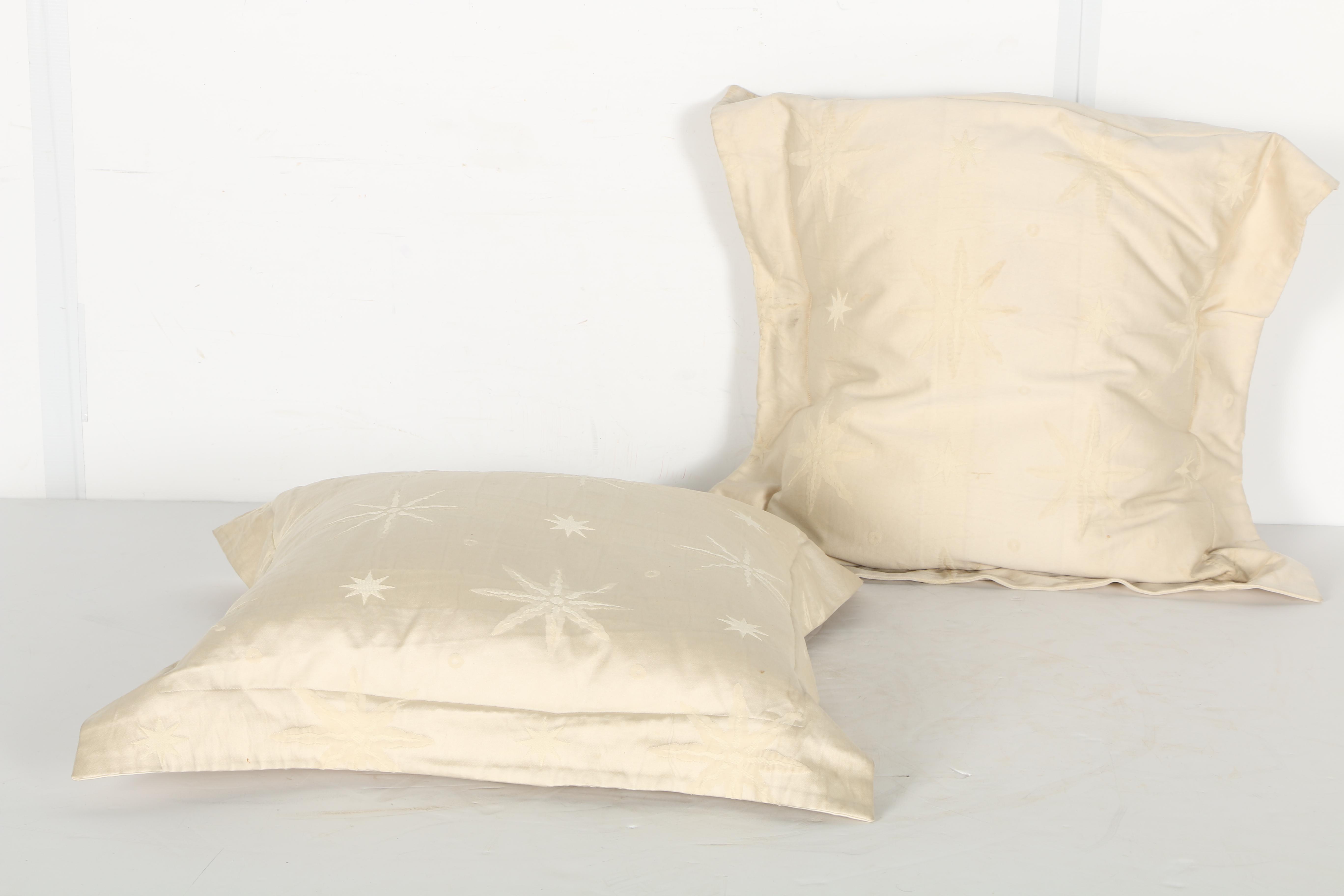Cream Pillows With Star and Leaf Motifs