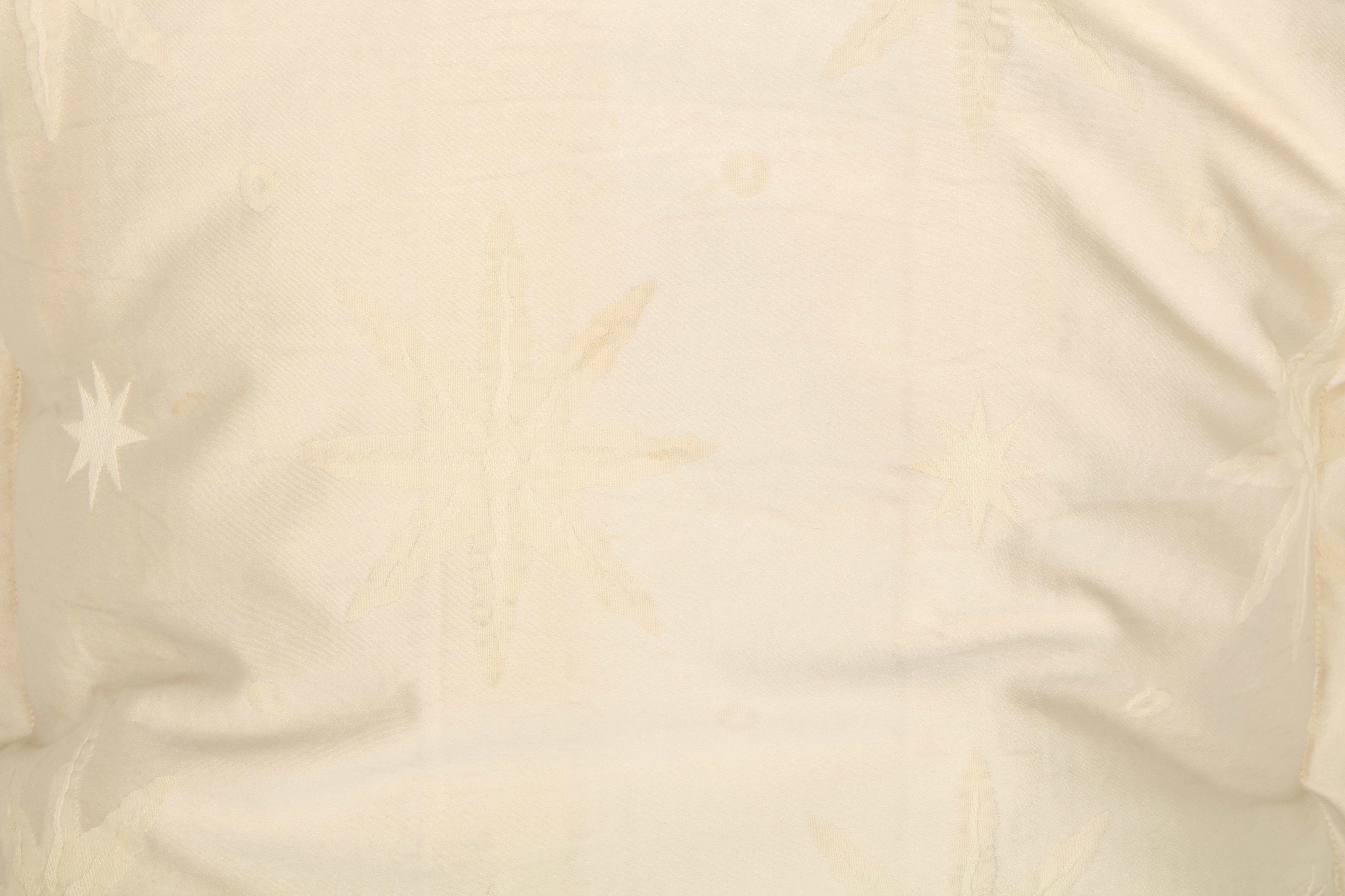 Cream Pillows With Star and Leaf Motifs