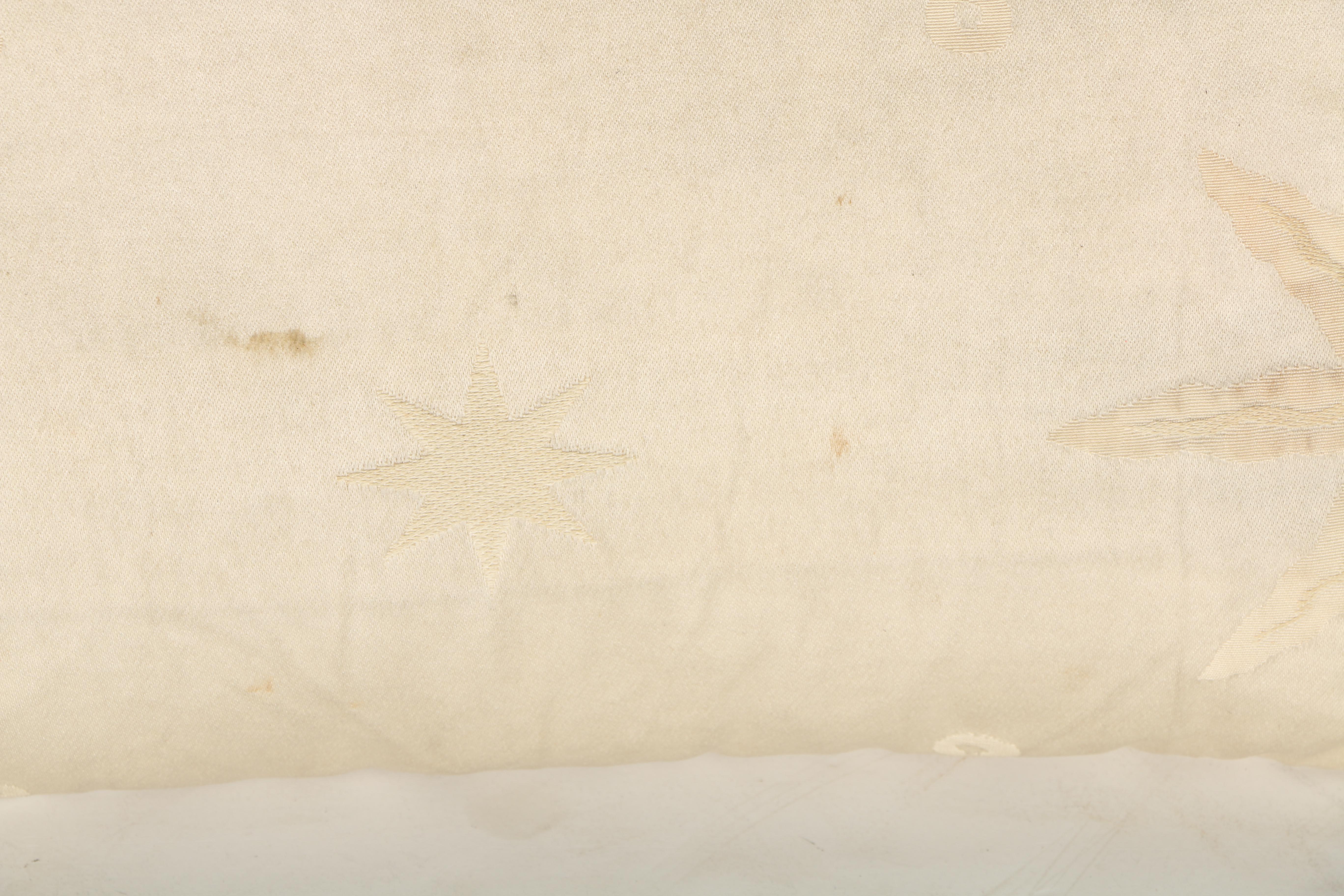 Cream Pillows With Star and Leaf Motifs