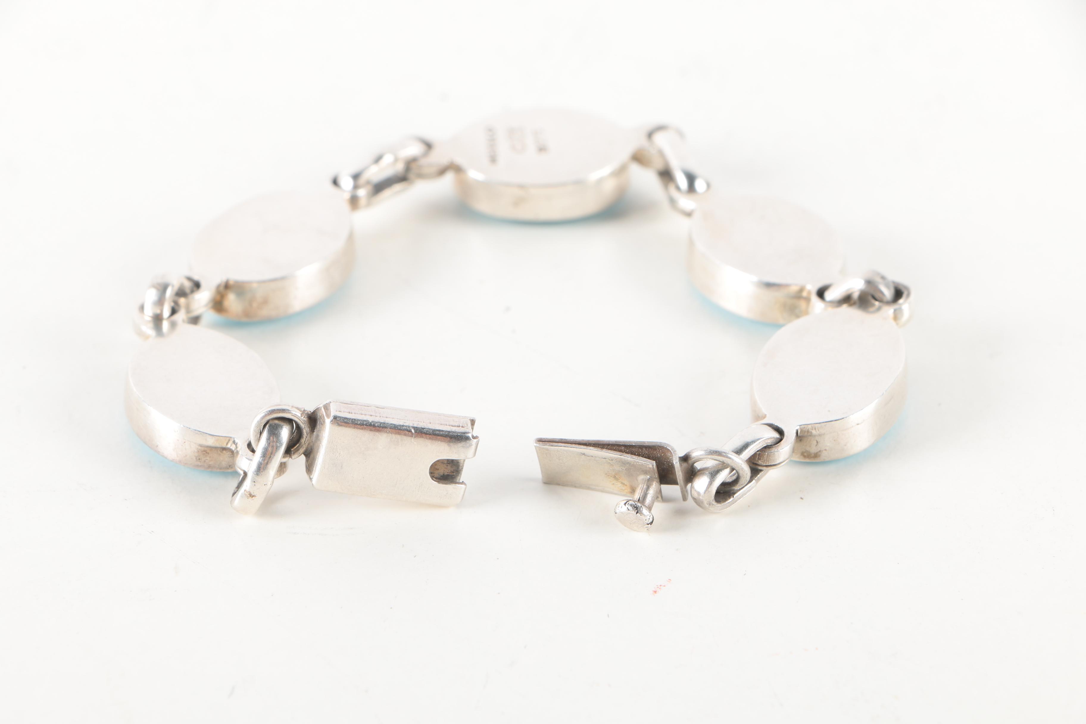 Sterling Silver Bracelets and Earrings Featuring Onyx and Shell