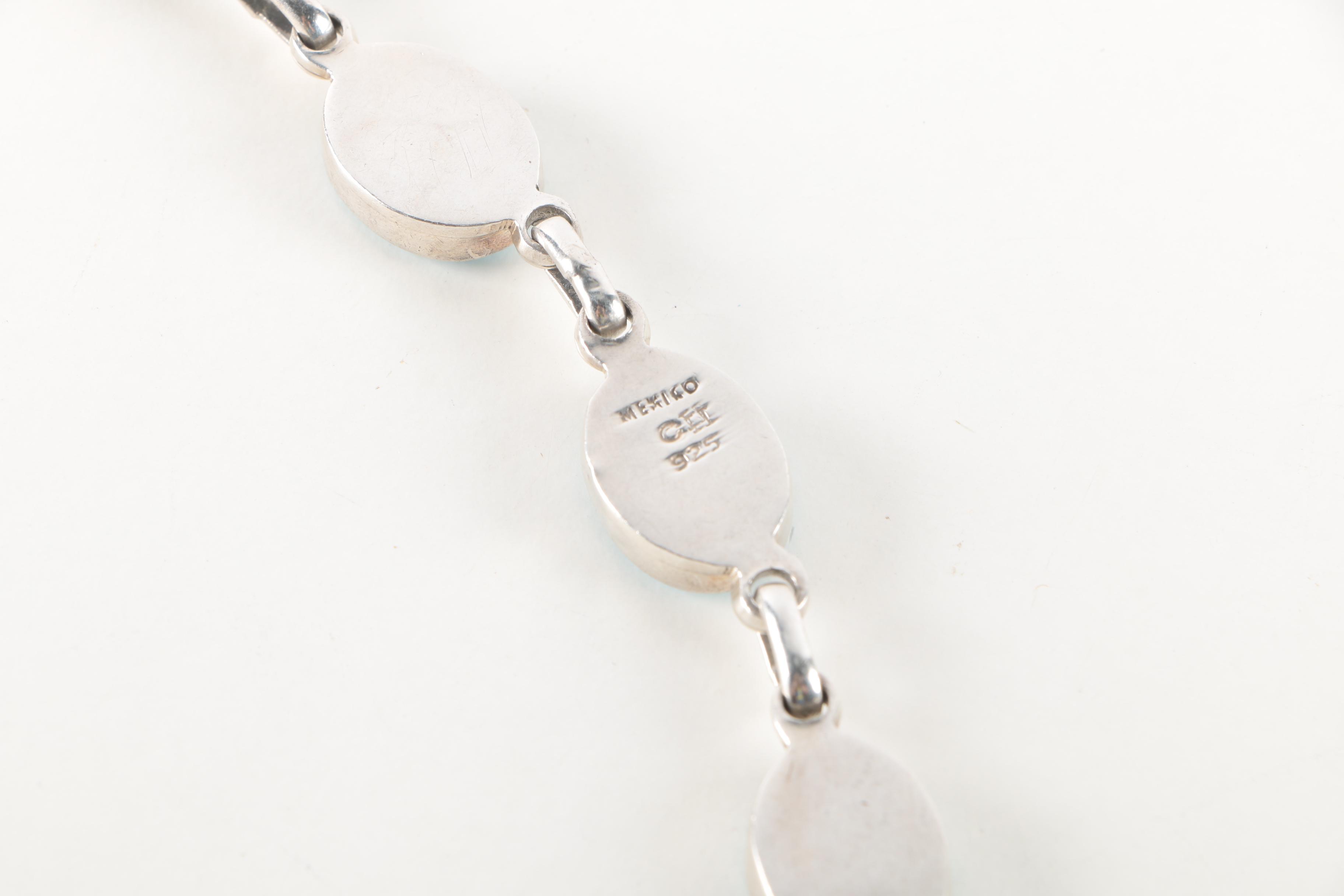 Sterling Silver Bracelets and Earrings Featuring Onyx and Shell