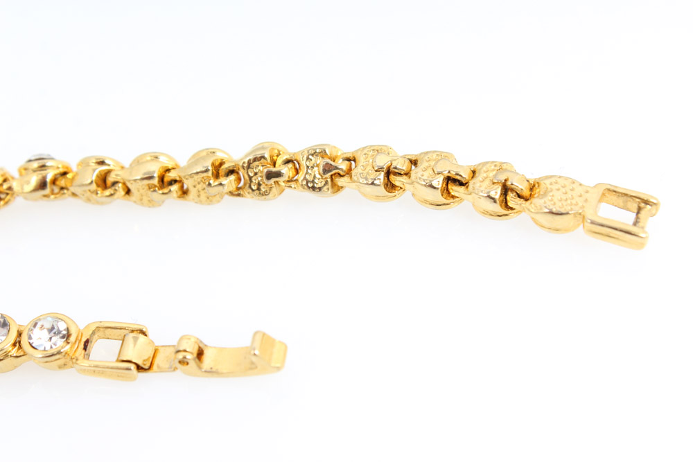 Pair of Gold-Tone Bracelets Featuring Jeray