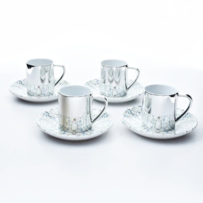 Four Damien Hirst "Virtue" Electroplated Cups and Saucers Four Damien Hirst "Virtue" Electroplated Cups and Saucers