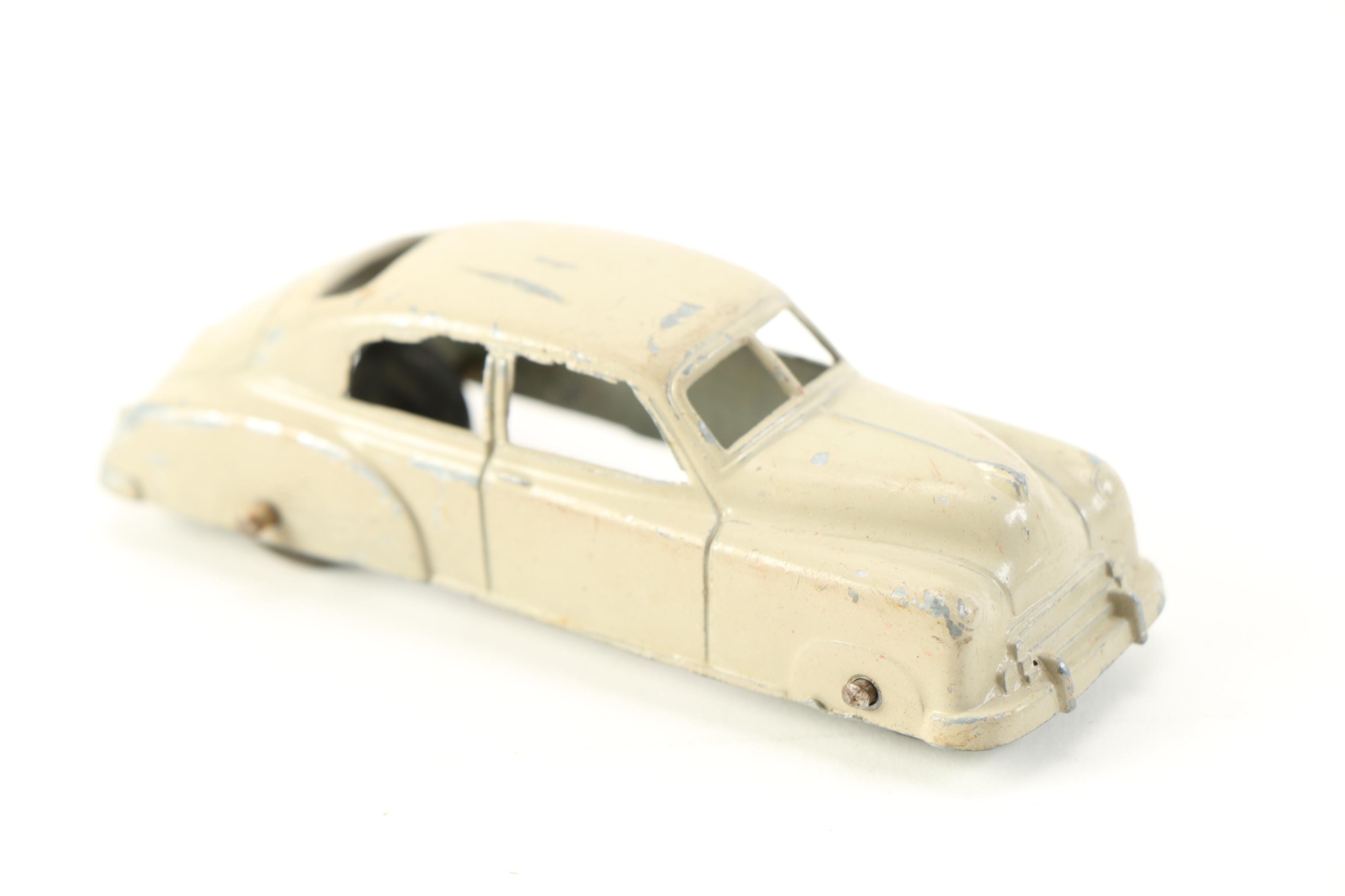 Die-Cast Cars and Elastolin Figures