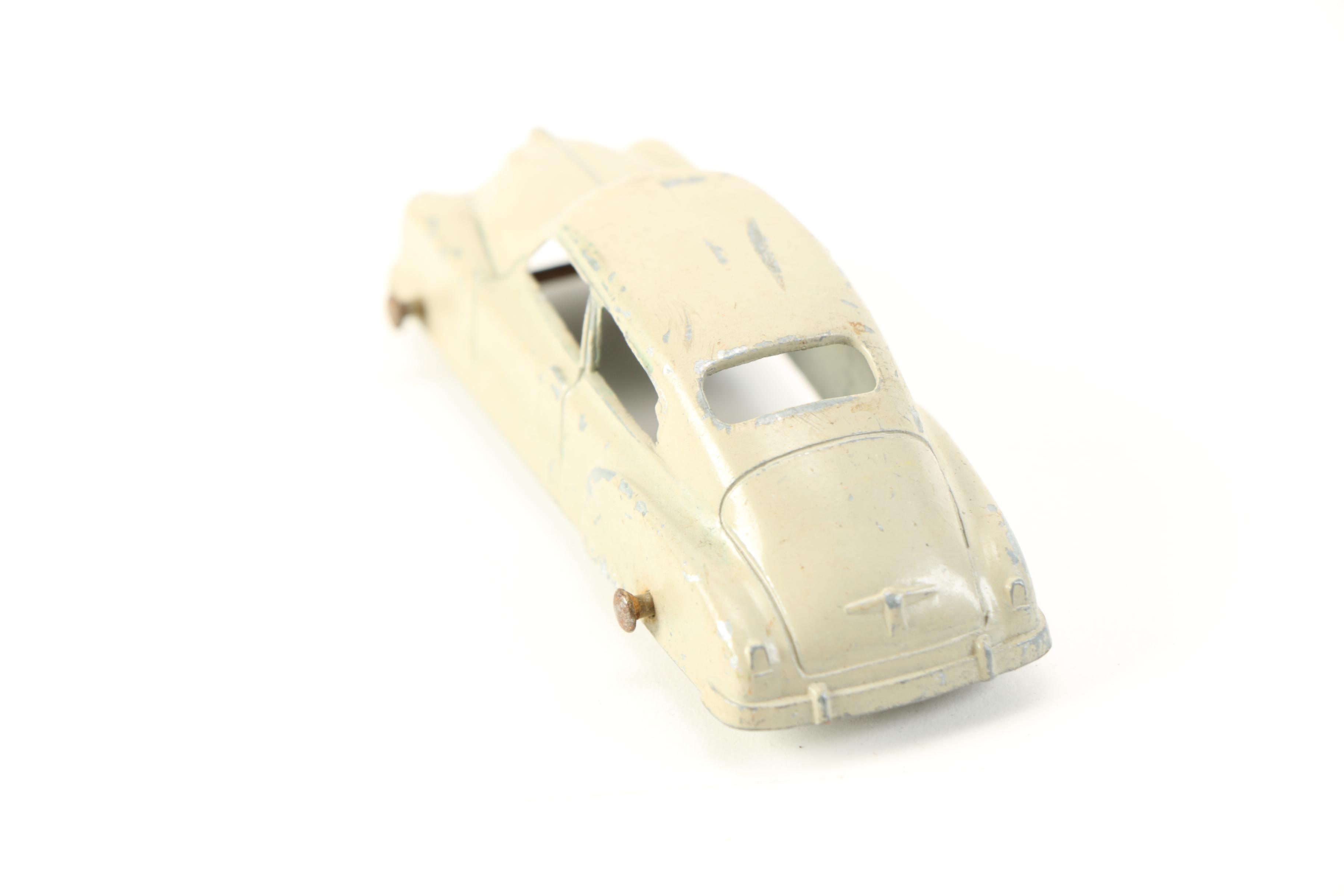 Die-Cast Cars and Elastolin Figures