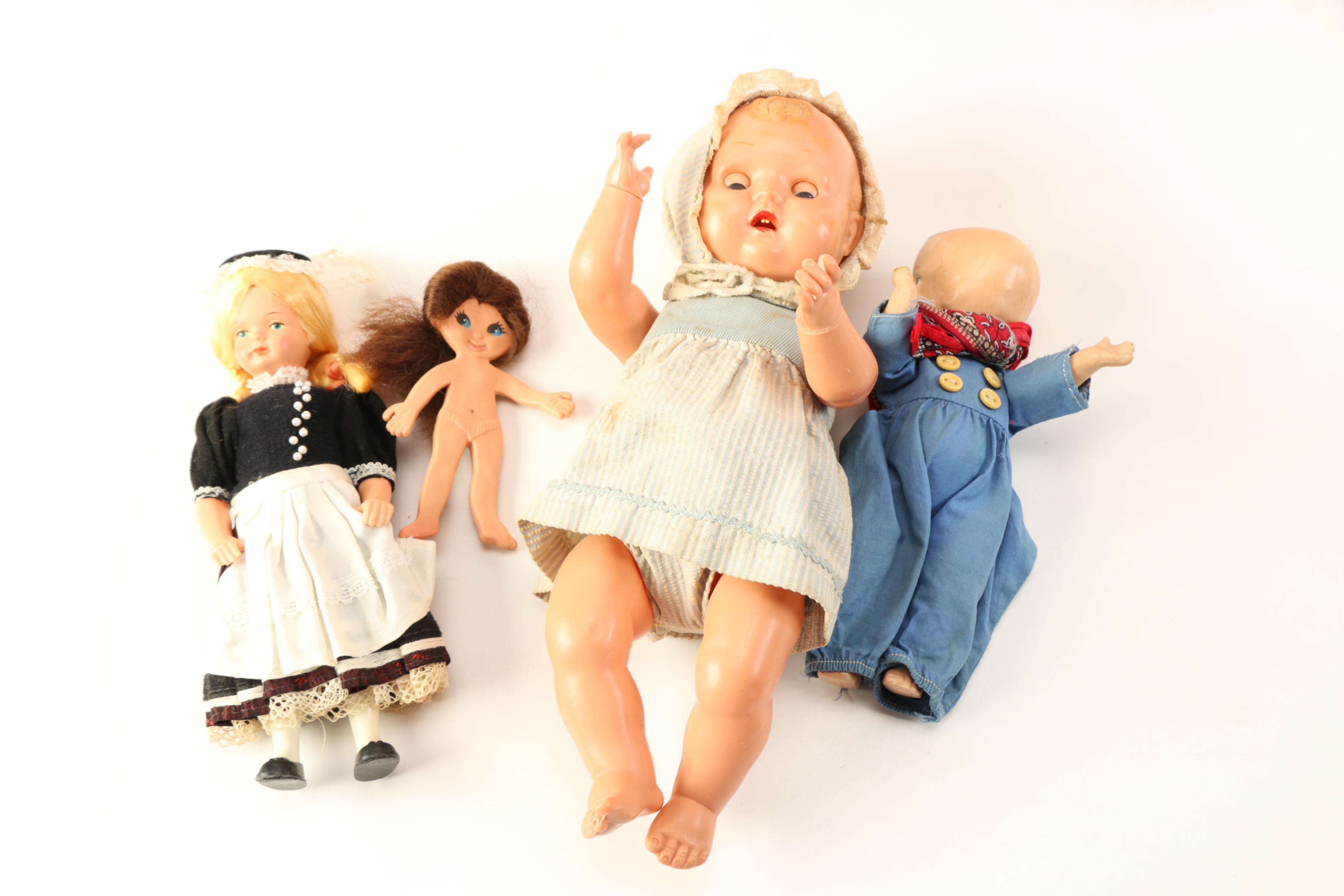 Asssorted Dolls and Doll Clothing