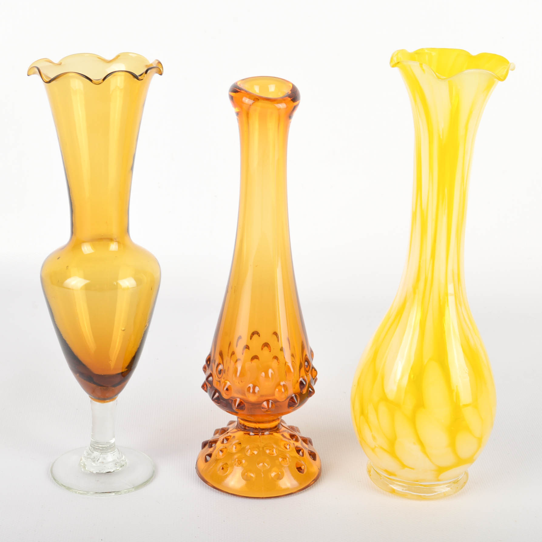 Seventeen Colorful Glass Bottles and Vases