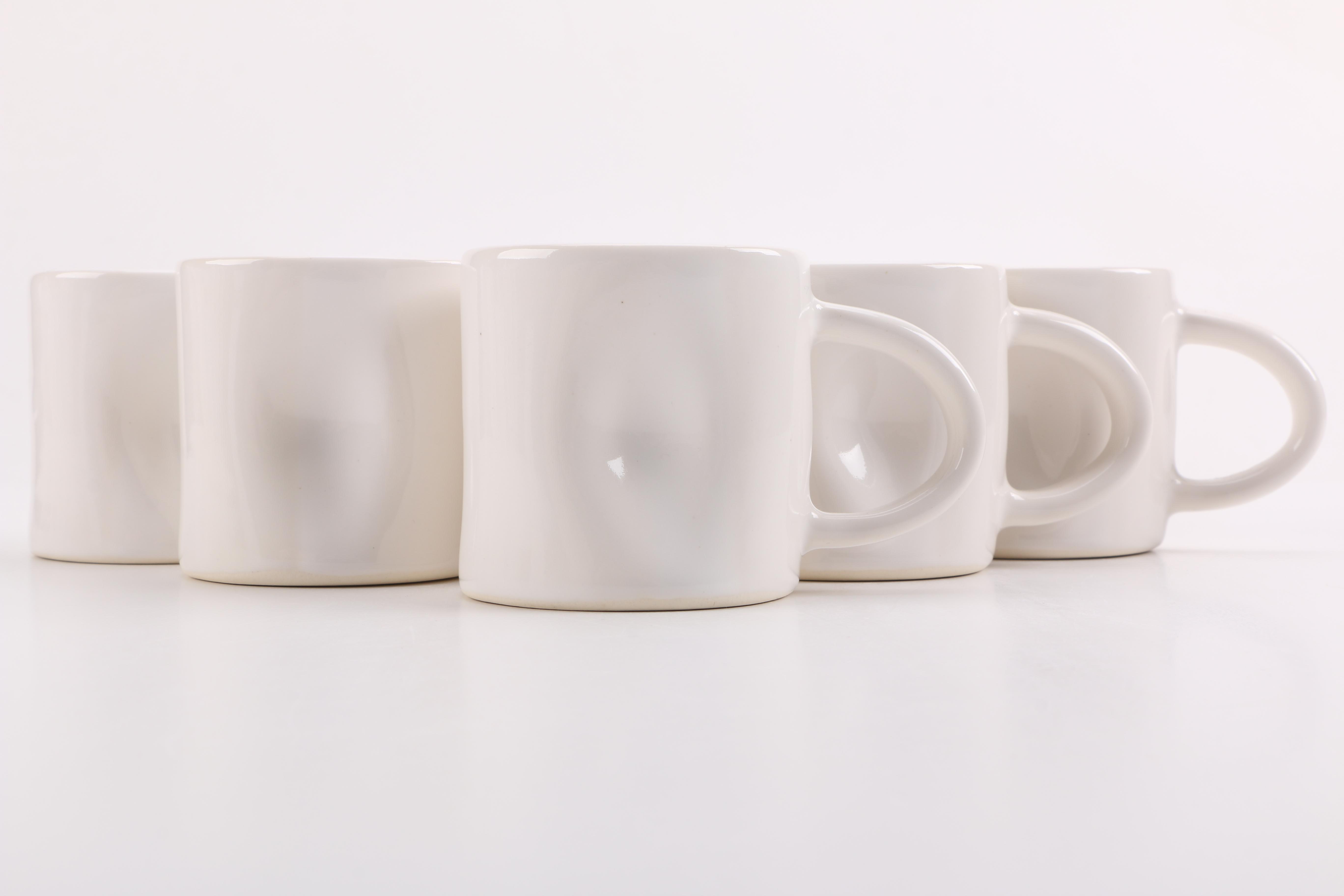 Handmade White Ceramic Mugs and Saucers