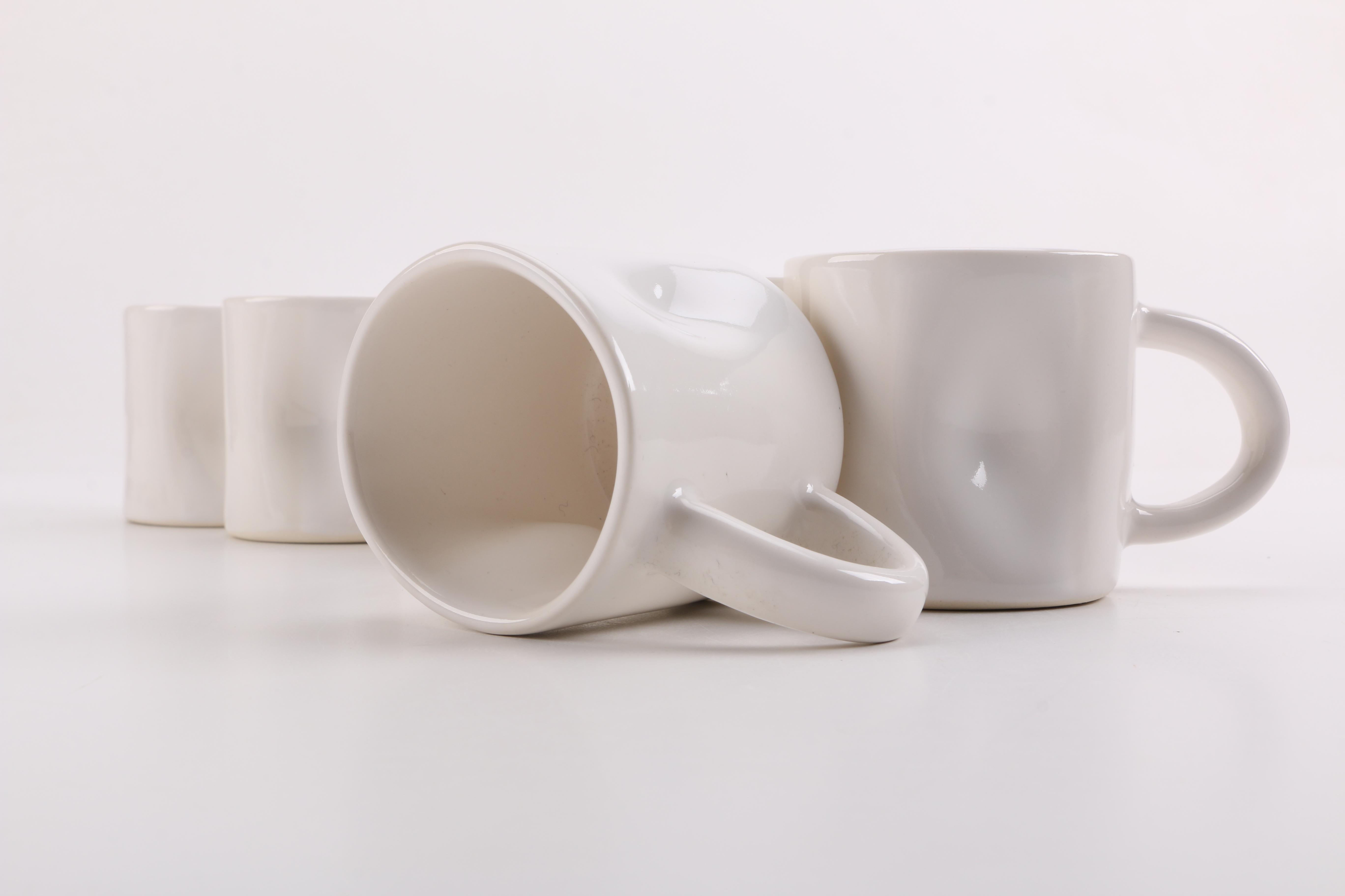Handmade White Ceramic Mugs and Saucers