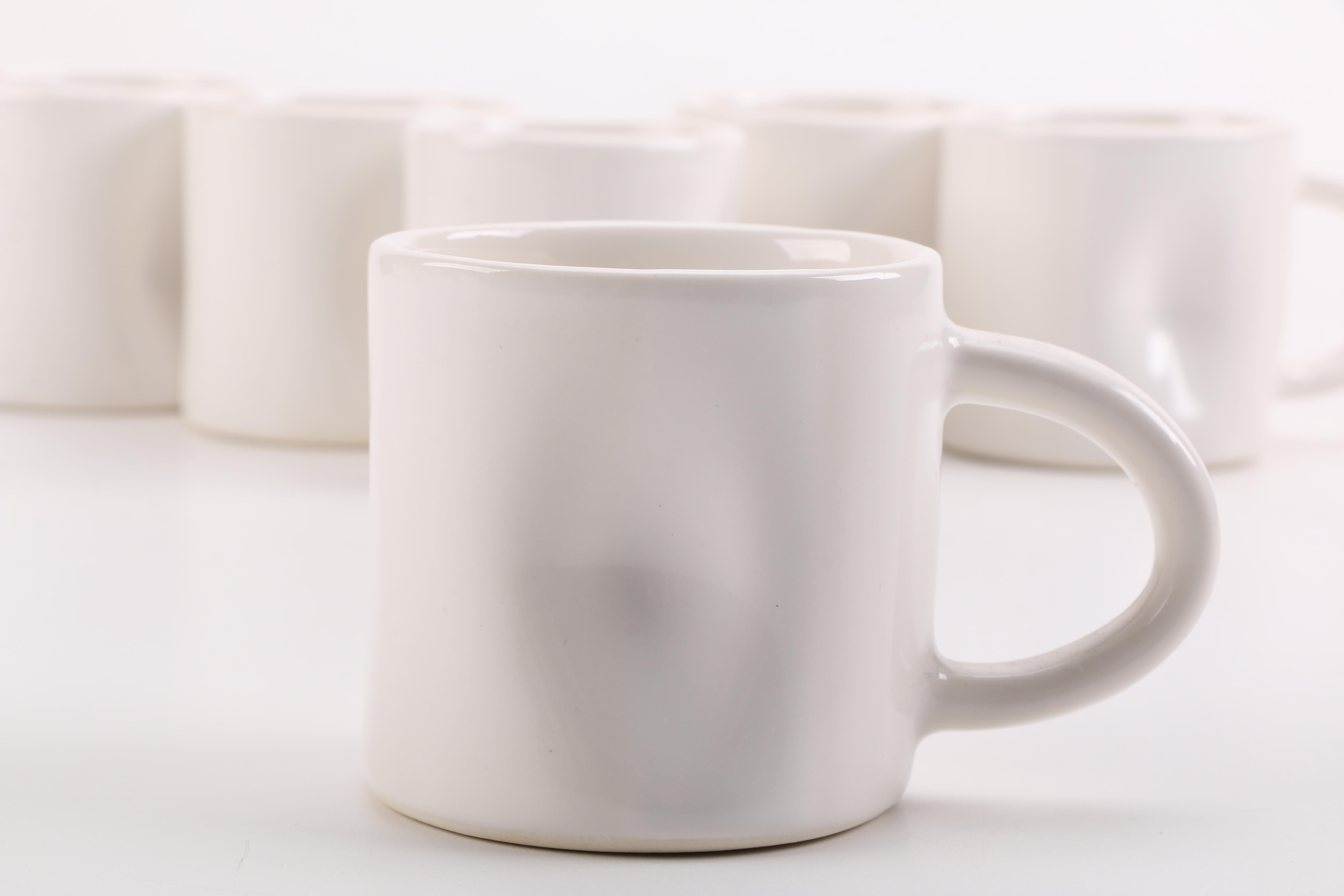 Handmade White Ceramic Mugs and Saucers