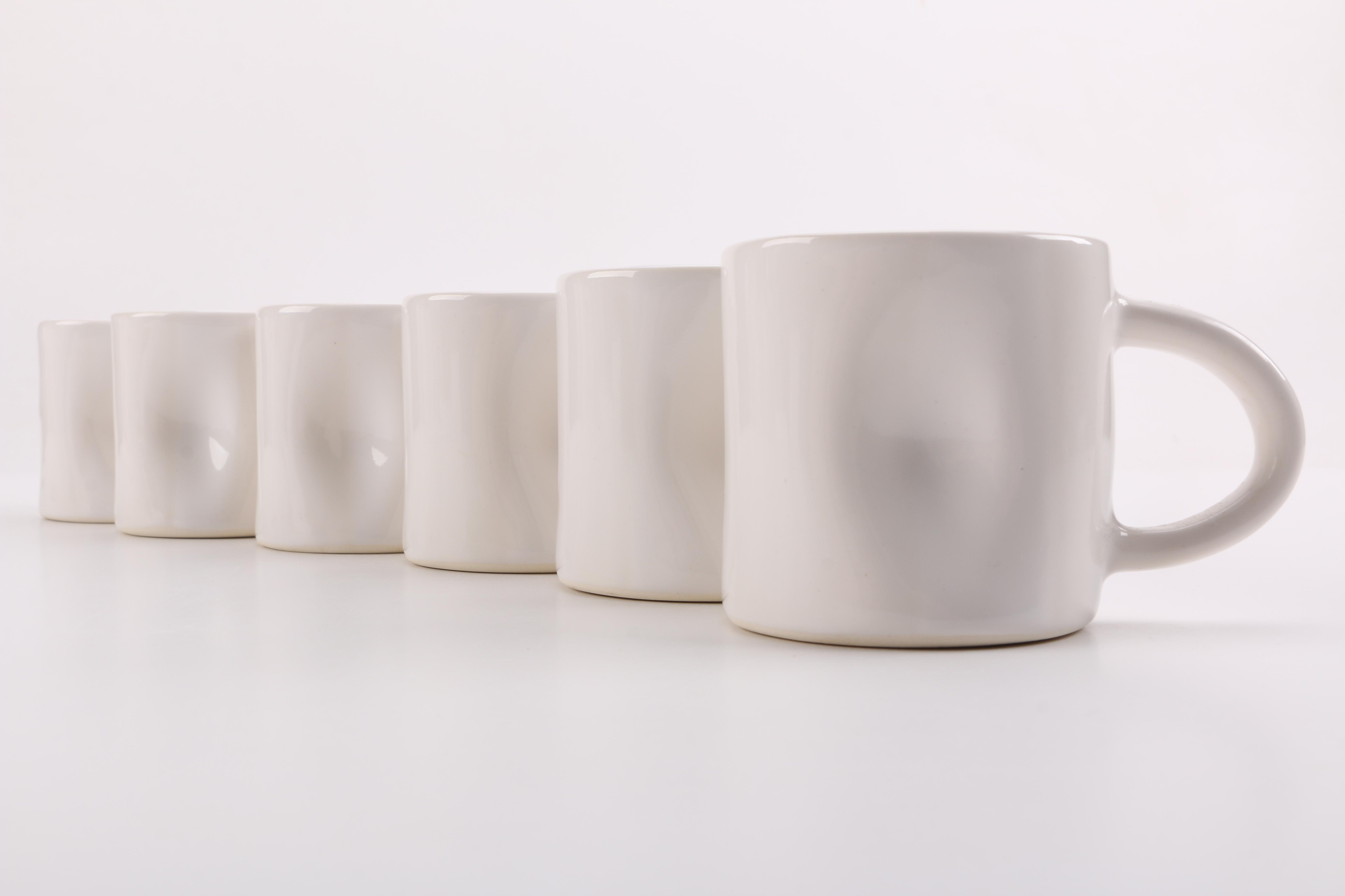 Handmade White Ceramic Mugs and Saucers