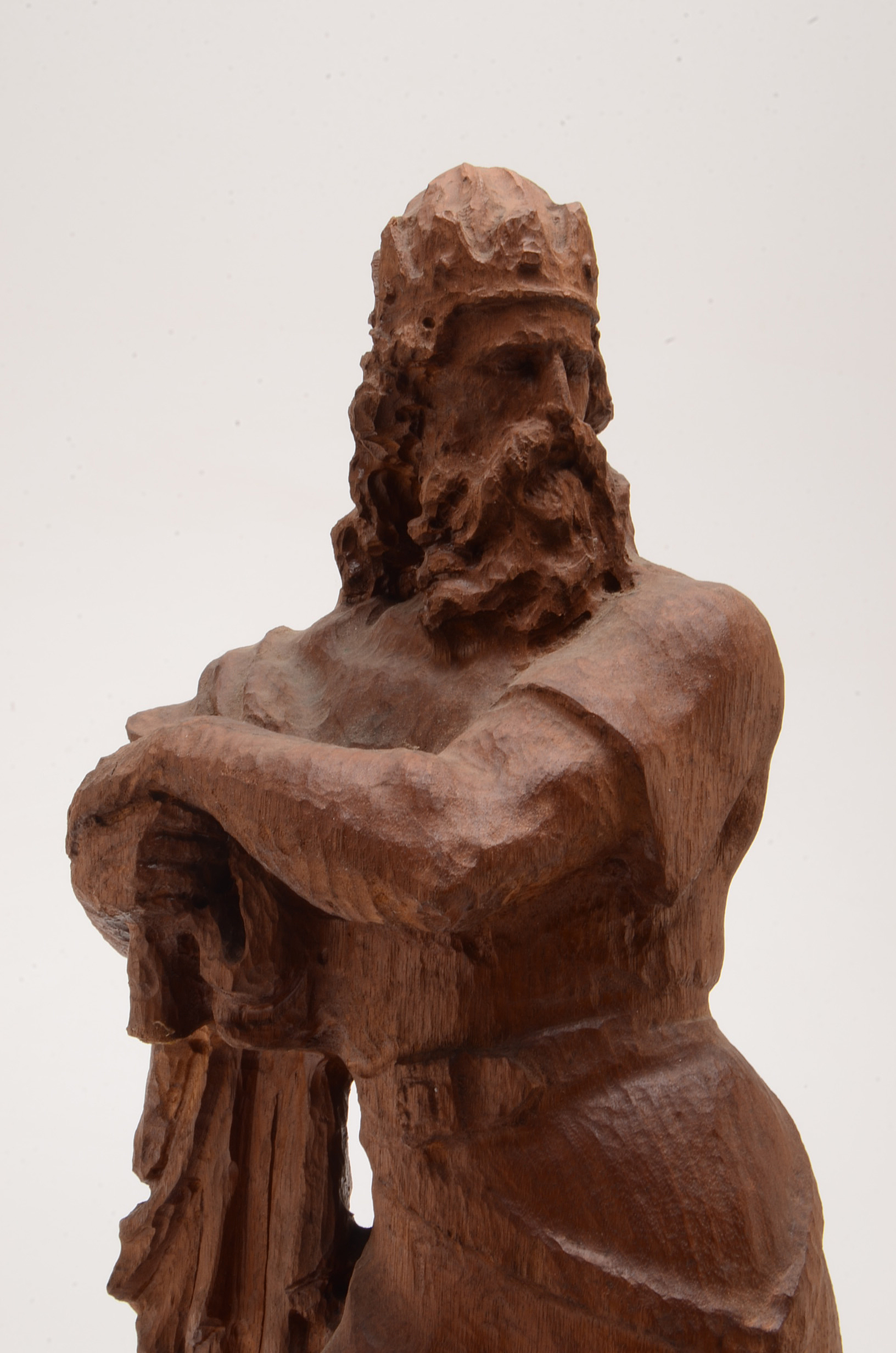 Hand Carved Statue of a Man Wearing a Crown