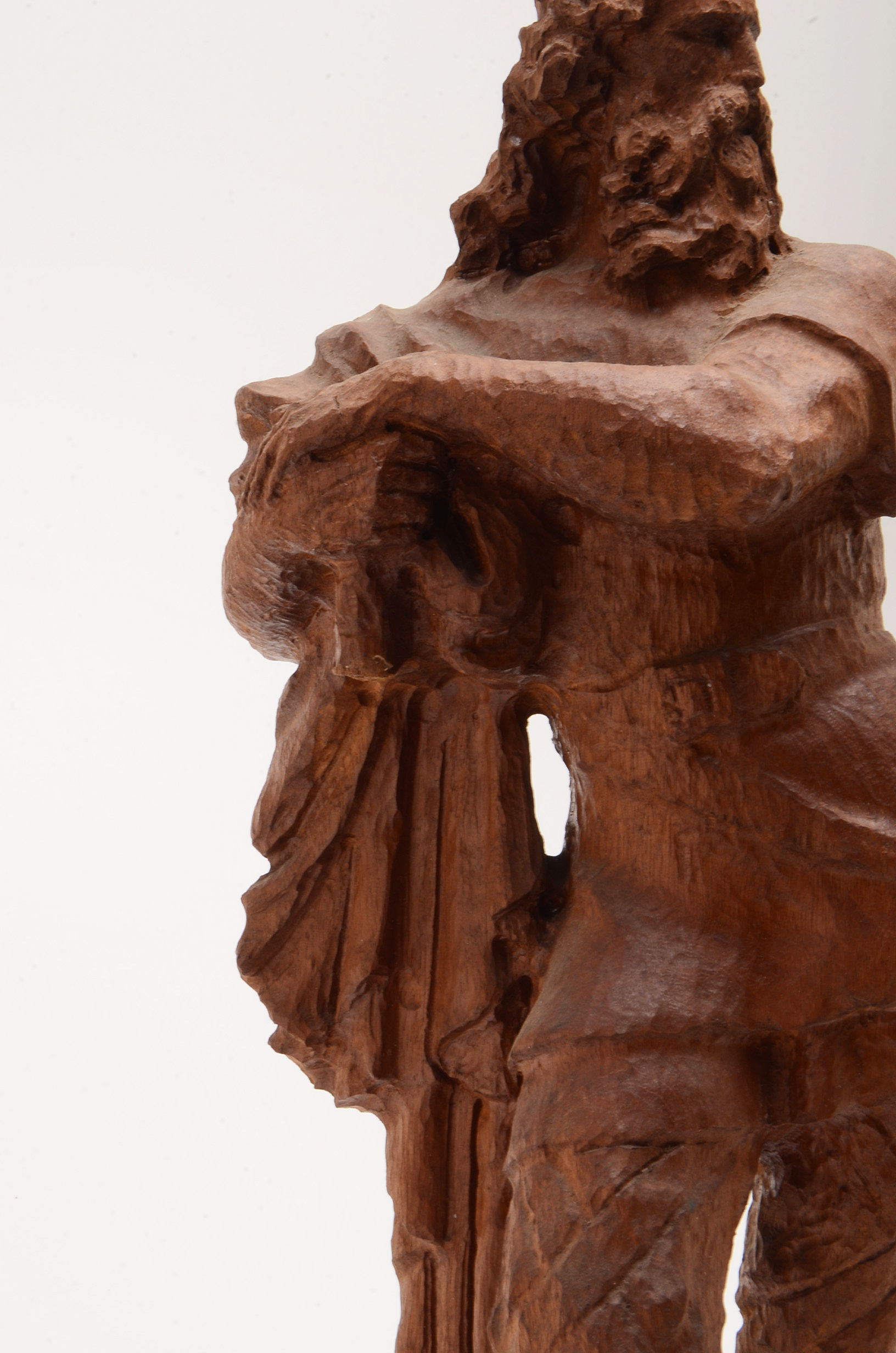 Hand Carved Statue of a Man Wearing a Crown