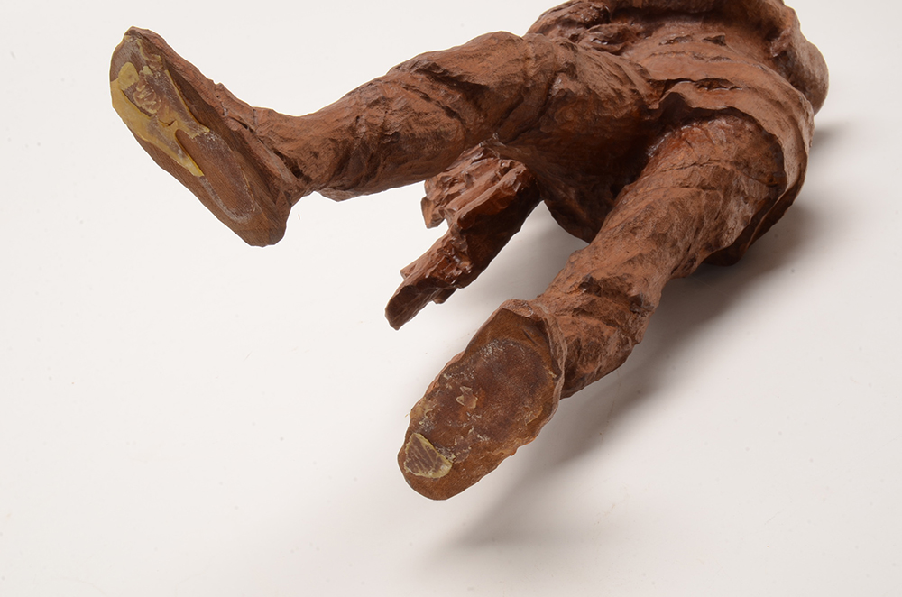 Hand Carved Statue of a Man Wearing a Crown